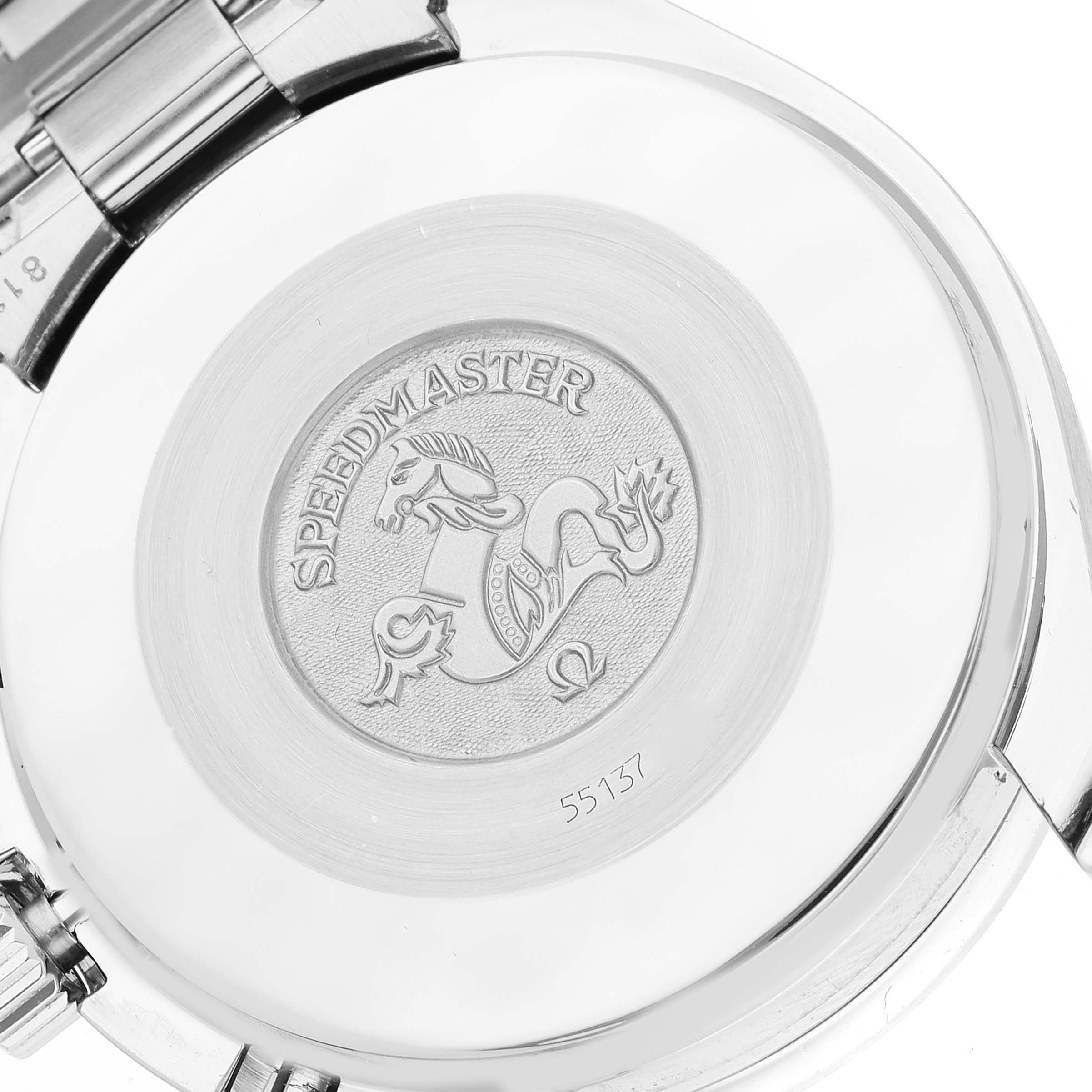 This image shows the back case of the Omega Speedmaster 3510.50.00 Men's Stainless Steel Black Dial 3510.50.00 Men's Stainless Steel Black Dial watch, featuring its logo and some engraved details.