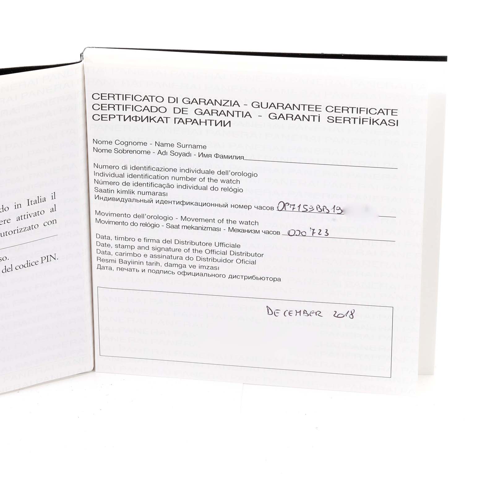 The image shows an open warranty certificate booklet for a Panerai Luminor PAM00797 Men
s Titanium Brown Dial PAM00797 Men
s Titanium Brown Dial watch, photographed from a slightly angled overhead view.