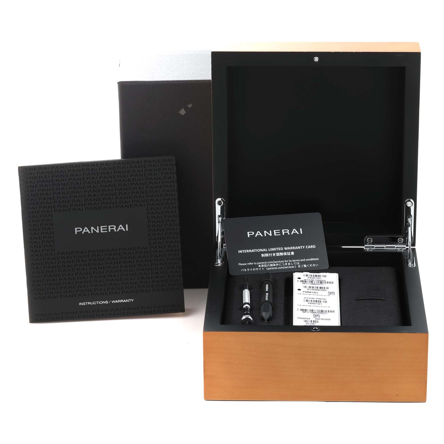 This image shows an open Panerai Luminor PAM01321 Men's Stainless Steel Black Dial PAM01321 Men's Stainless Steel Black Dial watch box with warranty card, instructions, and tools included.