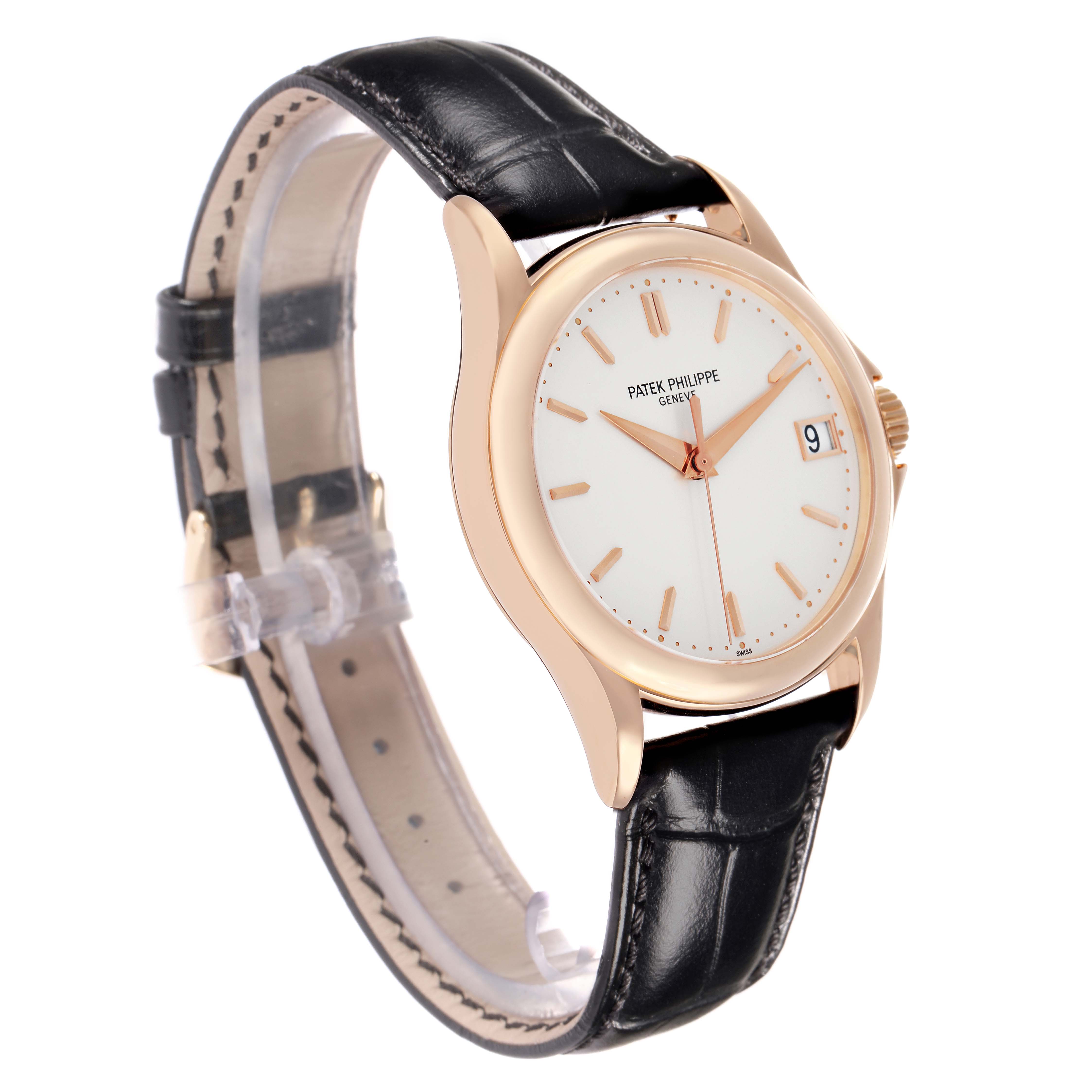 The Calatrava by Patek Philippe is shown at a three-quarter angle, highlighting its face, rose gold case, and black leather strap.