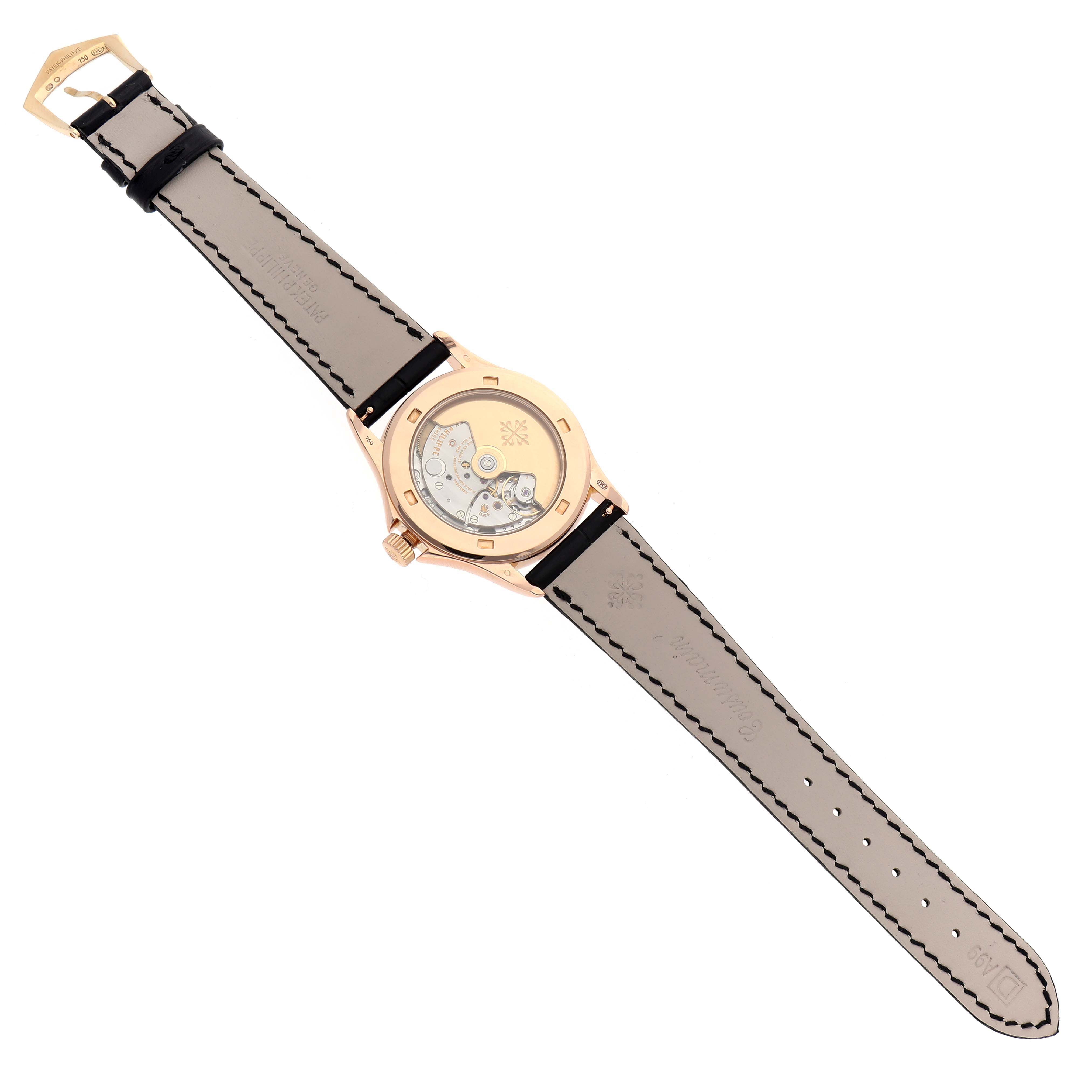 The Patek Philippe Calatrava 5127R Men
s Rose Gold Silver Dial watch is shown from the back, displaying its movement and leather strap laid flat.