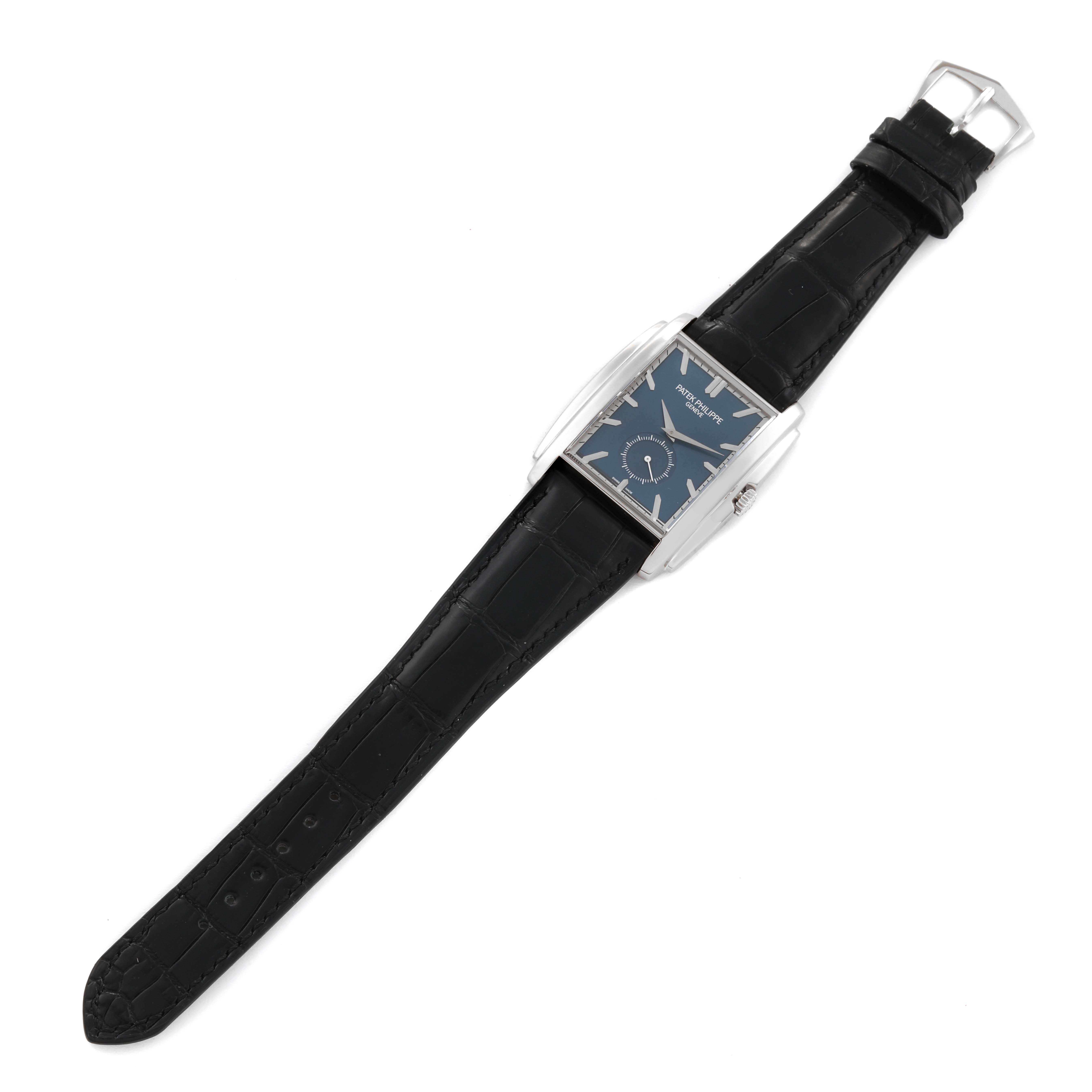 The Patek Philippe Gondolo 5124G-011 Men's White Gold Blue Dial 5124G-011 Men's White Gold Blue Dial watch is shown from a top-down angle, displaying the face, strap, and buckle.