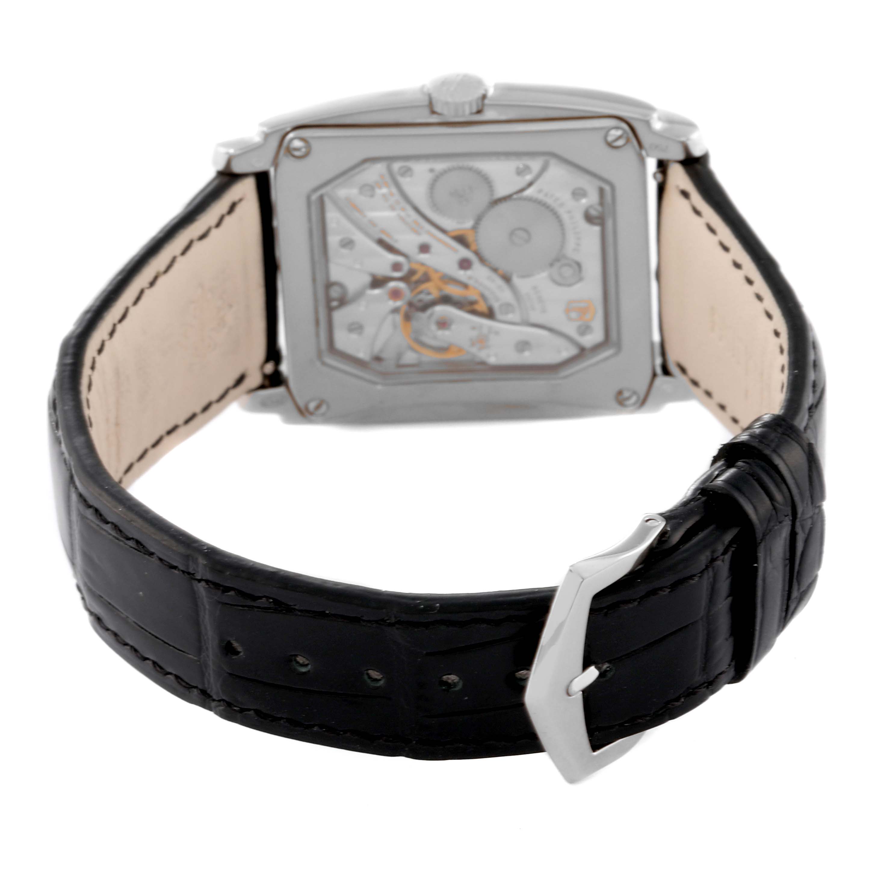 The image shows the back view of a Patek Philippe Gondolo 5124G-011 Men's White Gold Blue Dial 5124G-011 Men's White Gold Blue Dial watch, highlighting its movement and black leather strap with a buckle.