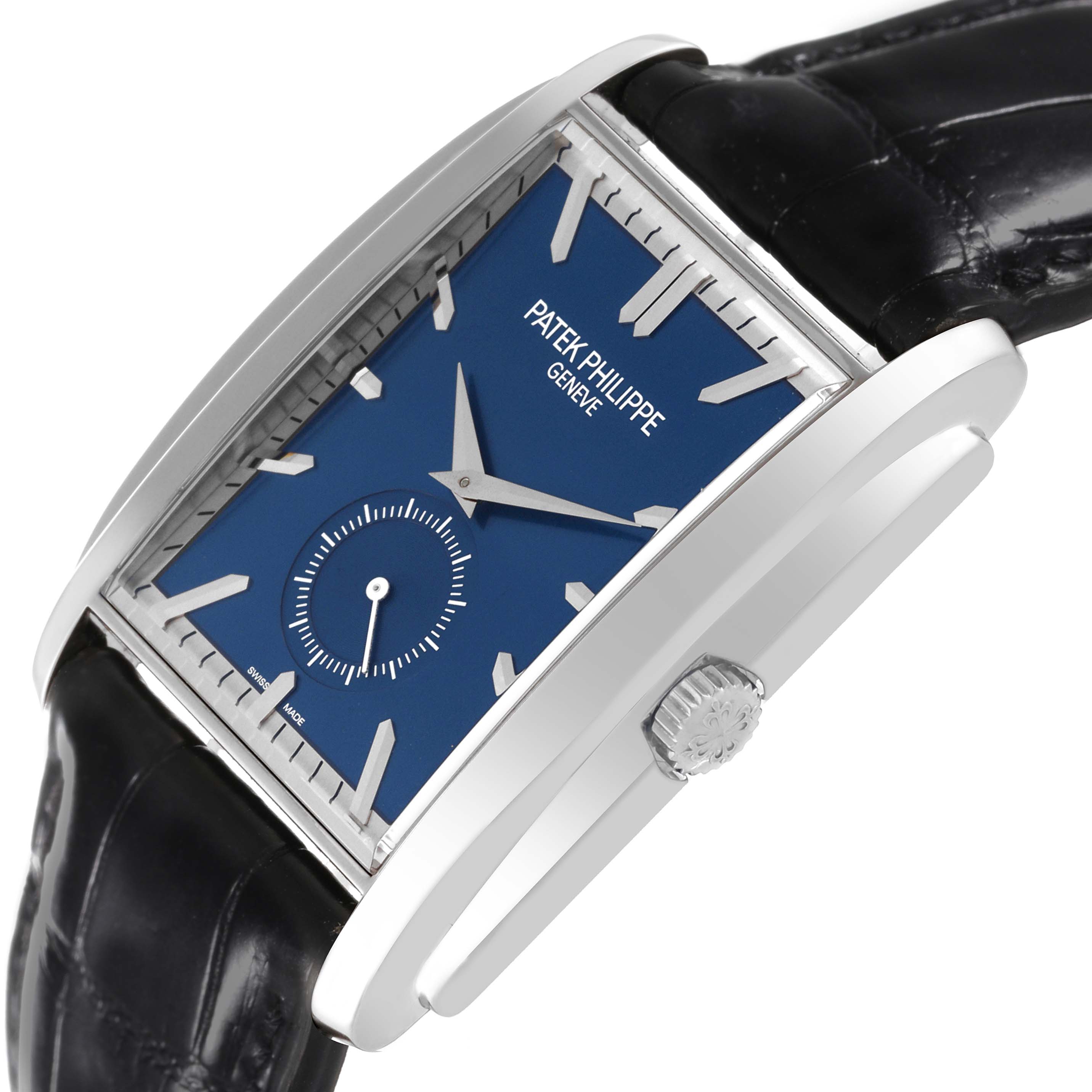 The image shows a tilted view of the Patek Philippe Gondolo 5124G-011 Men's White Gold Blue Dial 5124G-011 Men's White Gold Blue Dial watch, highlighting its blue dial, crown, and black leather strap.