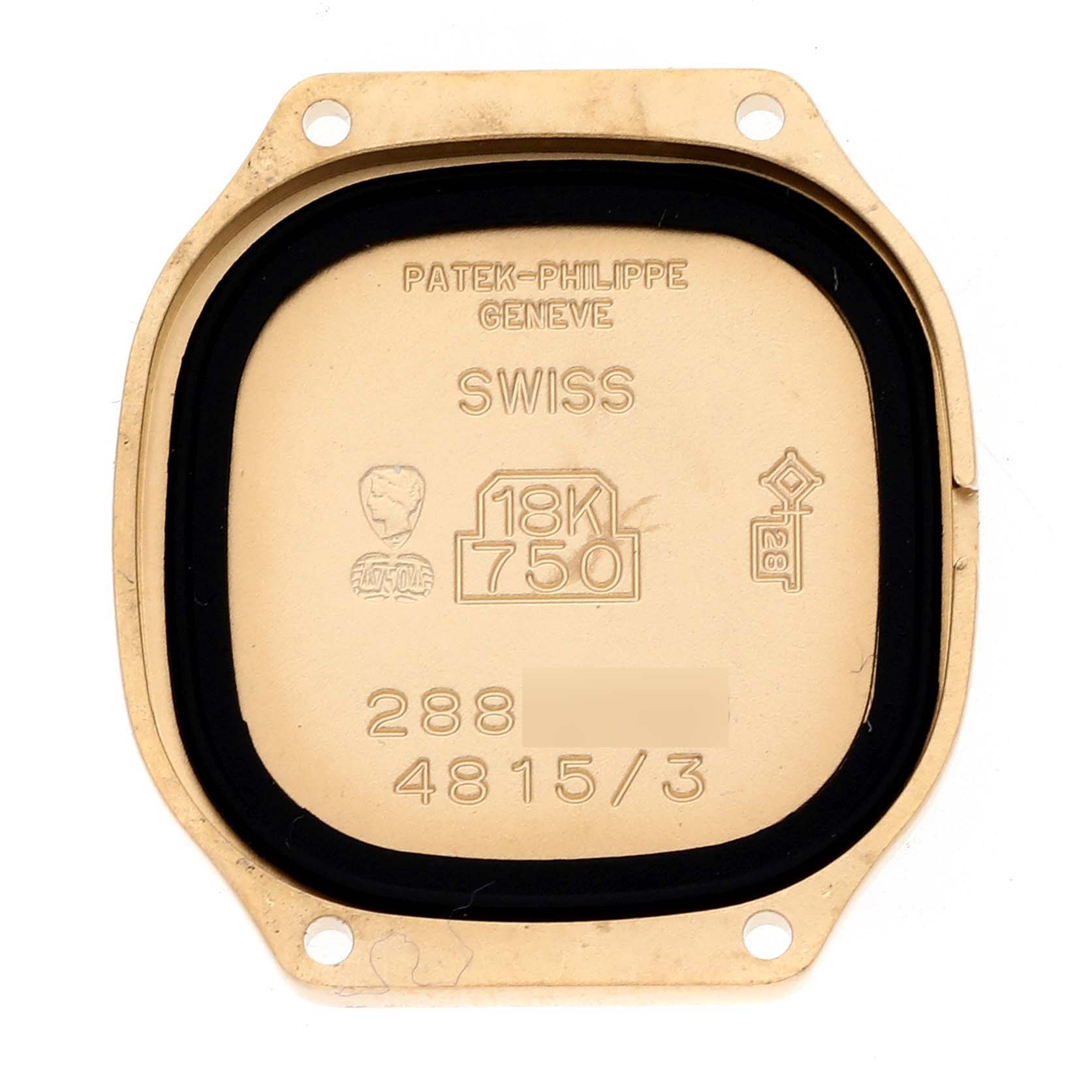 This image shows the back case of a La Flamme model watch by Patek Philippe, featuring inscriptions and hallmarks.