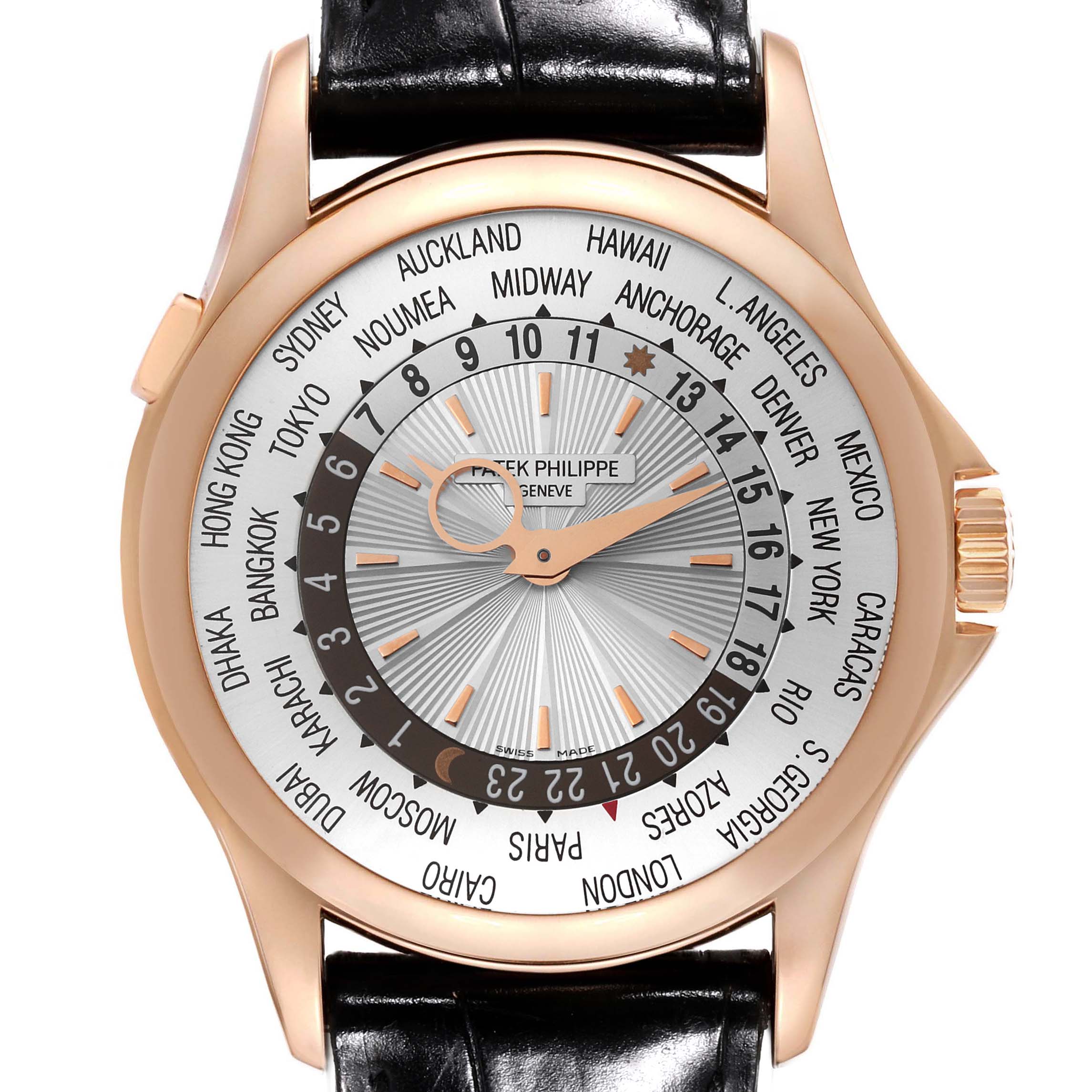 The image shows a front view of a Patek Philippe Complications 5130R-001 Men's Rose Gold Silver Dial 5130R-001 Men's Rose Gold Silver Dial watch, highlighting the dial with world time zones and city names.
