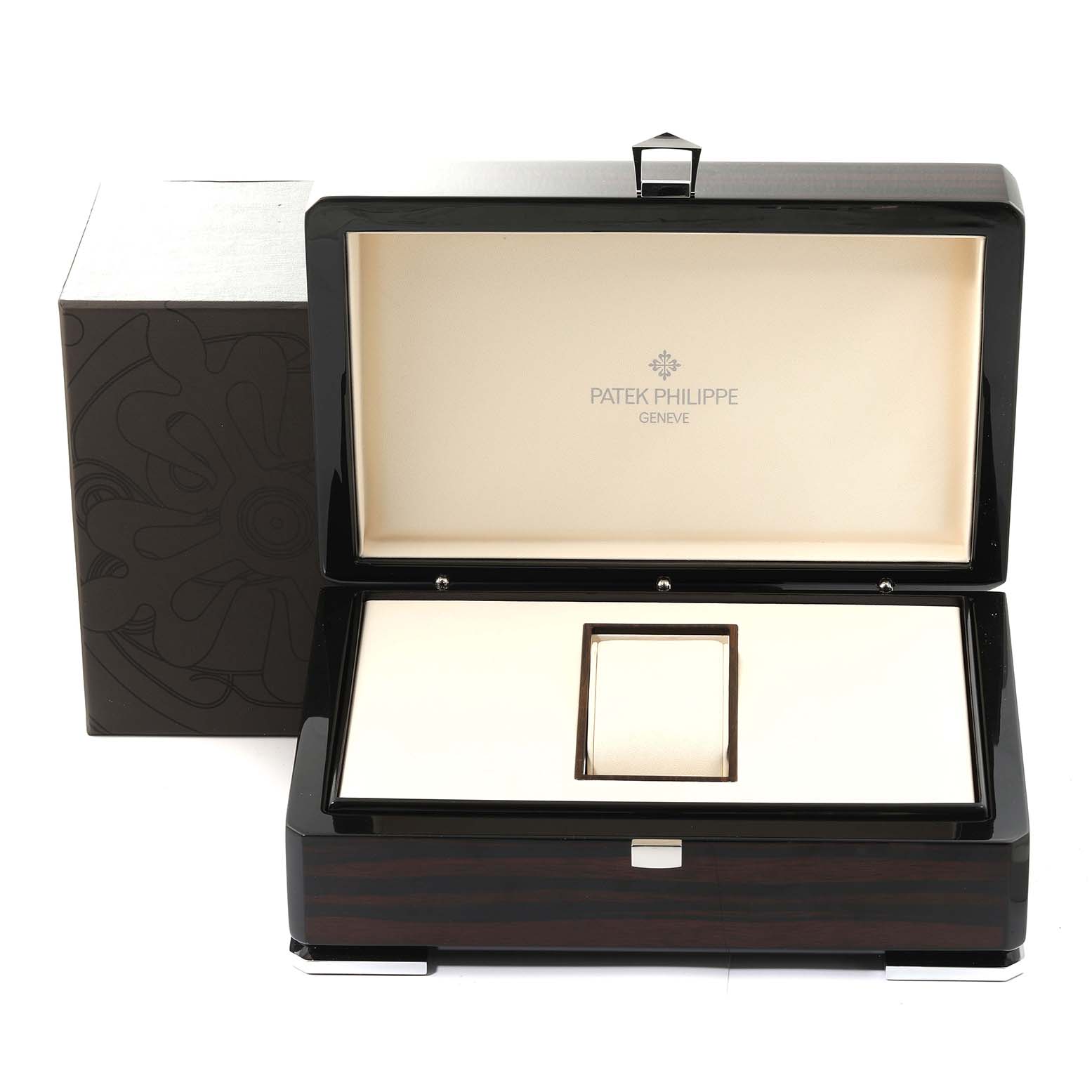 This is an open box of a Patek Philippe Complications 5130R-001 Men's Rose Gold Silver Dial 5130R-001 Men's Rose Gold Silver Dial model watch, showing its interior.