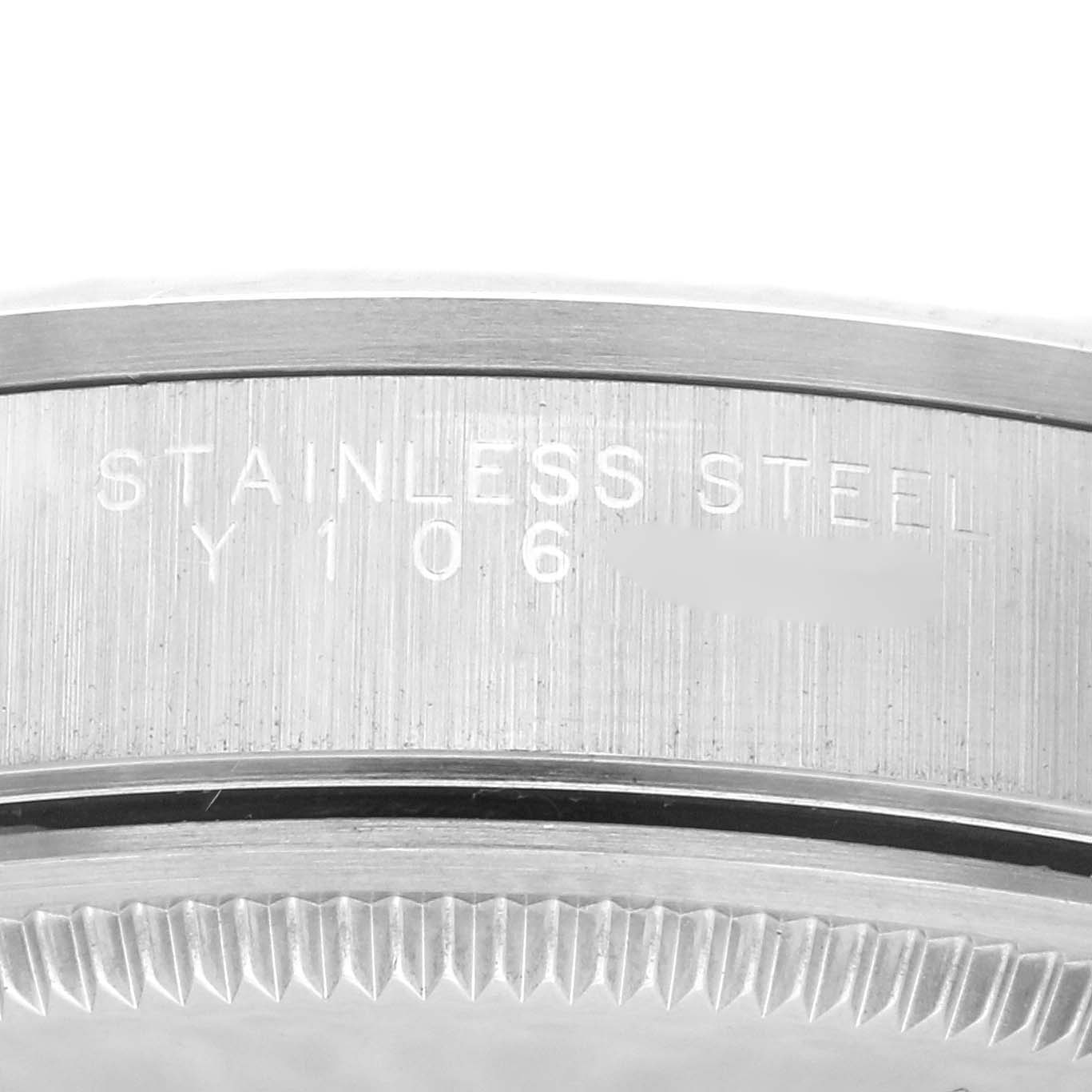 This is a close-up view of the side of the Rolex Air-King 14000M Men's Stainless Steel Blue Dial 14000M Men's Stainless Steel Blue Dial watch case, showing "STAINLESS STEEL" engraving.