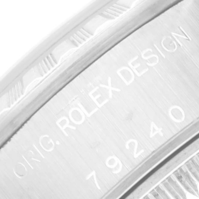 This close-up image shows the side casing of a Rolex Date 79240 Women
s Stainless Steel Silver Dial 79240 Women
s Stainless Steel Silver Dial watch, highlighting the engraved "ORIG. ROLEX DESIGN" and model number.