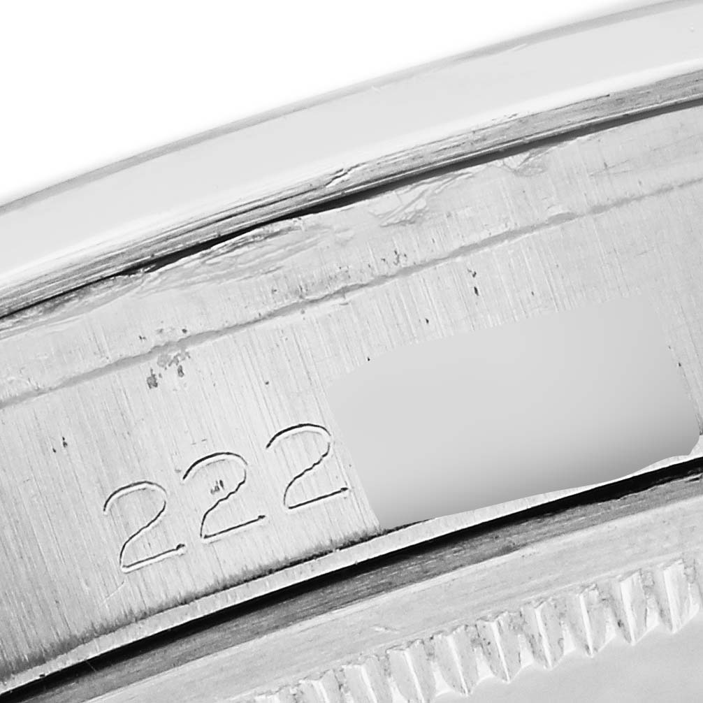 This image shows a close-up of the case back of a Vintage Collection model by Rolex, highlighting the serial number.