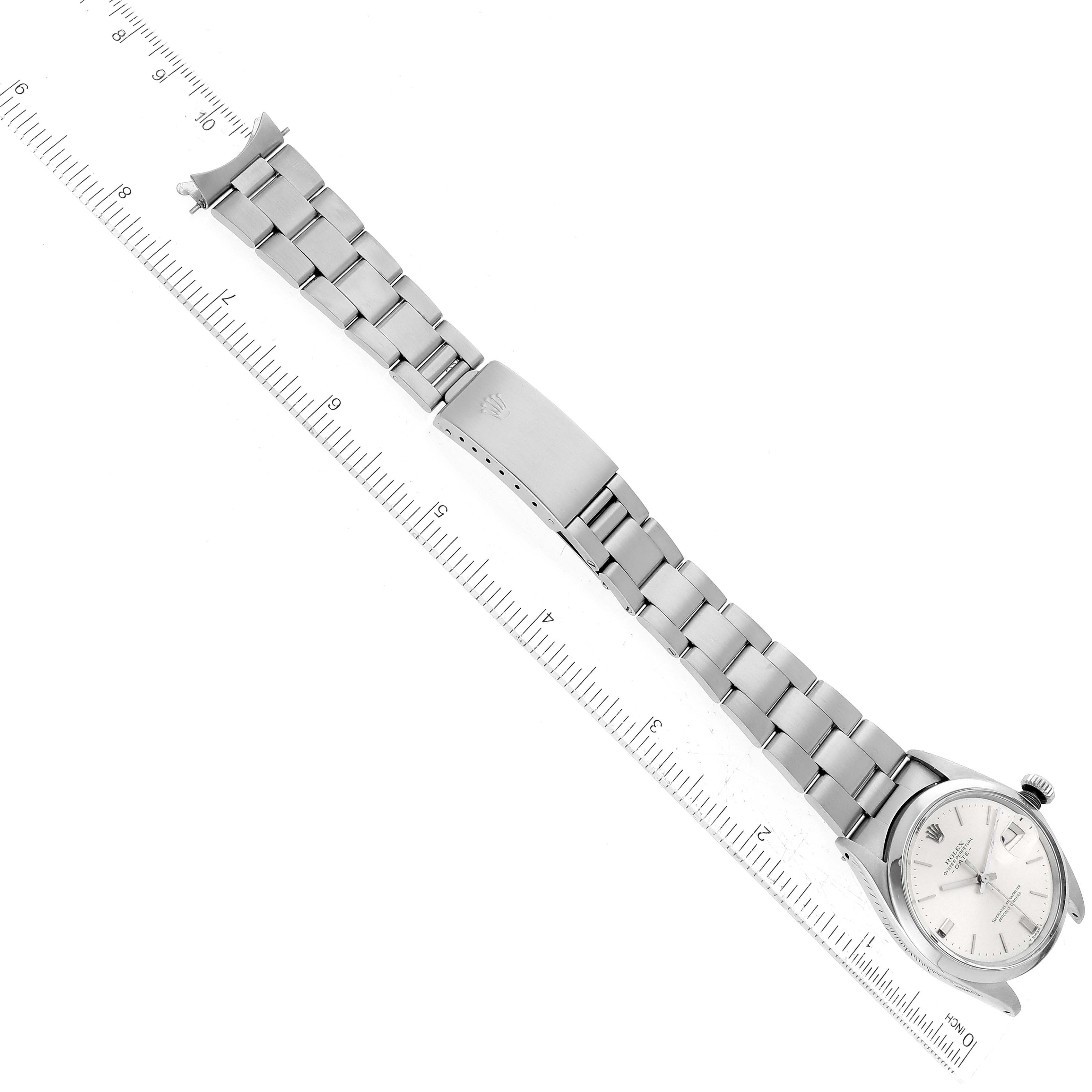 The image shows a top-down view of a Rolex Vintage Collection 1500 Men's Stainless Steel Silver Dial 1500 Men's Stainless Steel Silver Dial watch, focusing on its metal strap and clasp.