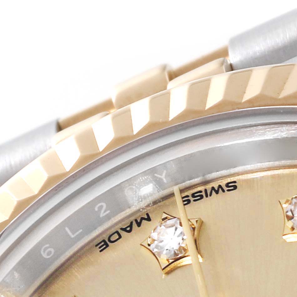 This close-up image of a Rolex Datejust 279173 Women's Steel and Gold (two tone) Champagne Dial 279173 Women's Steel and Gold (two tone) Champagne Dial watch shows the bezel, part of the dial, and a section of the bracelet.