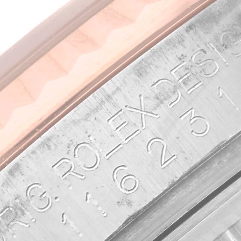 This is a close-up angle showing the engraved side of the case on a Rolex Datejust 116231 Men's Steel and Gold (two tone) Pink Dial 116231 Men's Steel and Gold (two tone) Pink Dial watch.