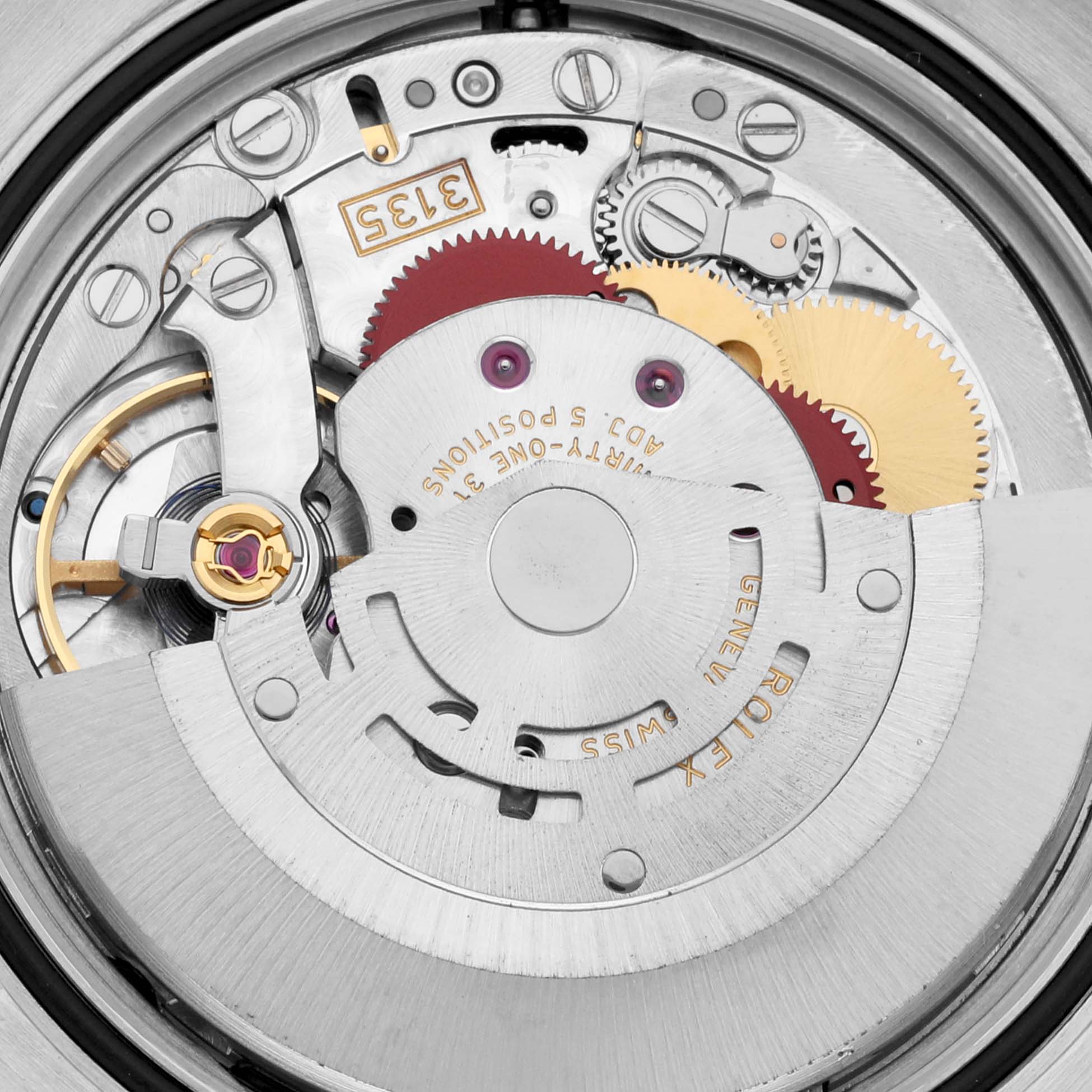 This image shows a close-up of the movement assembly of a Rolex Datejust 116231 Men's Steel and Gold (two tone) Pink Dial 116231 Men's Steel and Gold (two tone) Pink Dial watch, highlighting the gears and rotors.
