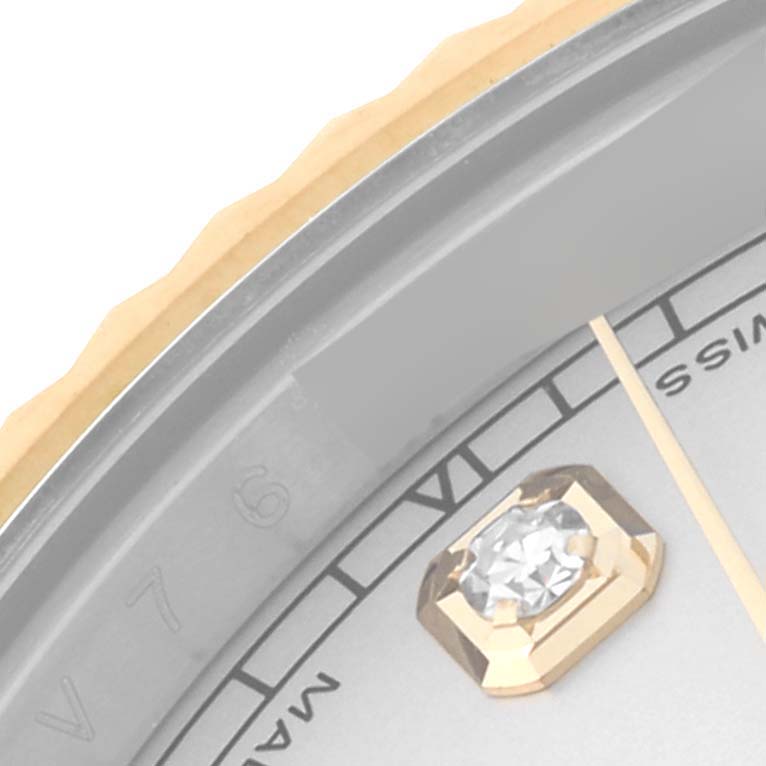 This image shows a close-up of the bezel, part of the dial, and the diamond hour marker of a Rolex Datejust 41 116333 Men's Steel and Gold (two tone) Silver Dial 116333 Men's Steel and Gold (two tone) Silver Dial watch.