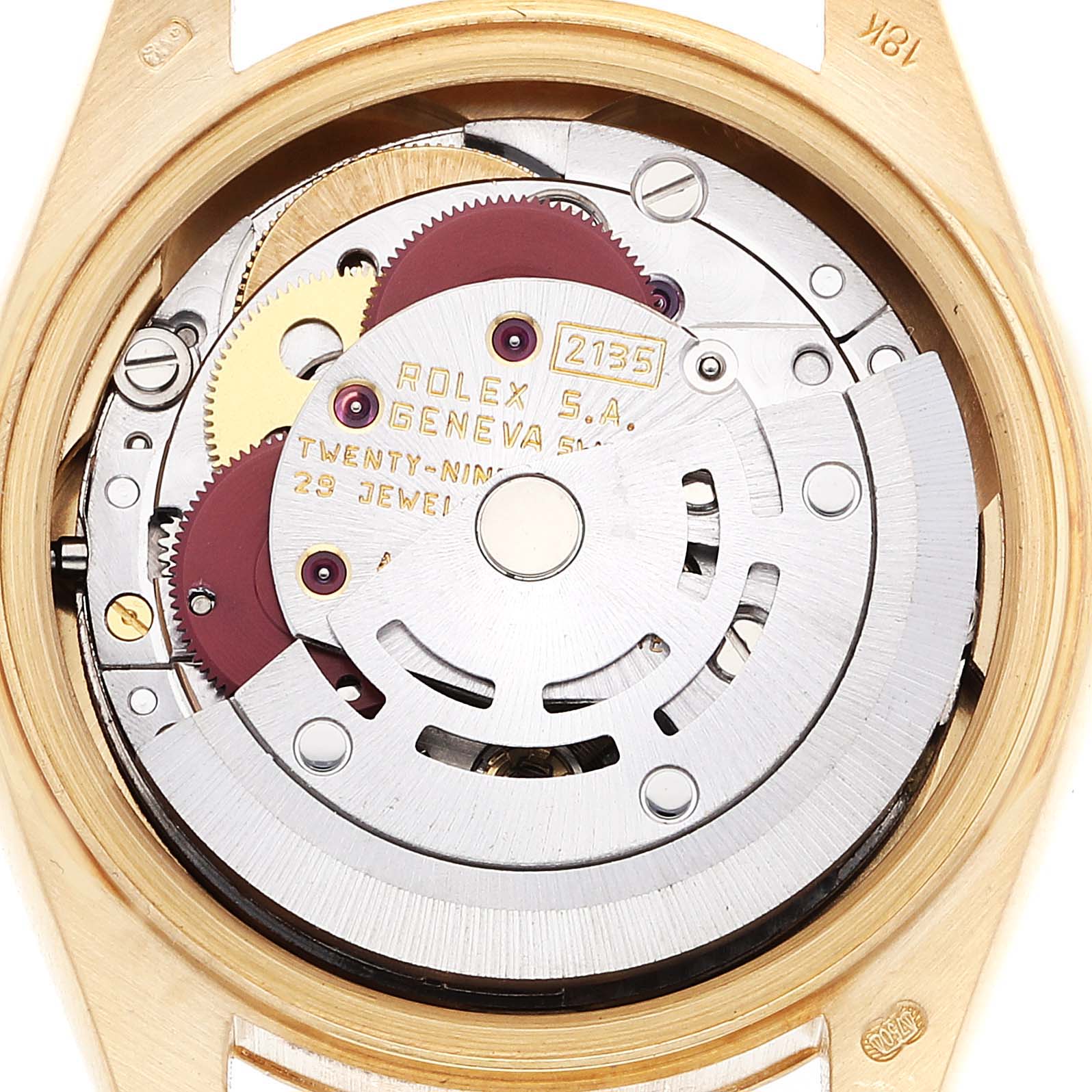 The image shows the internal mechanism of a Rolex President 69178 Women's Yellow Gold Champagne Dial 69178 Women's Yellow Gold Champagne Dial model watch from a top-down angle, revealing intricate gears and inscriptions.