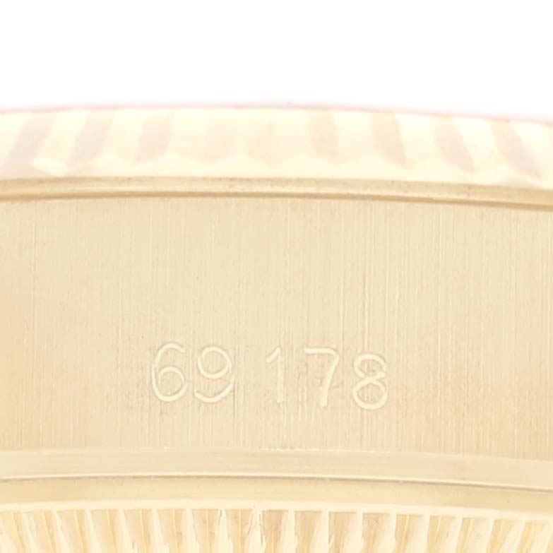 This close-up image shows the side of the Rolex President 69178 Women's Yellow Gold Champagne Dial 69178 Women's Yellow Gold Champagne Dial model watch case, highlighting the engraved reference number "69178".