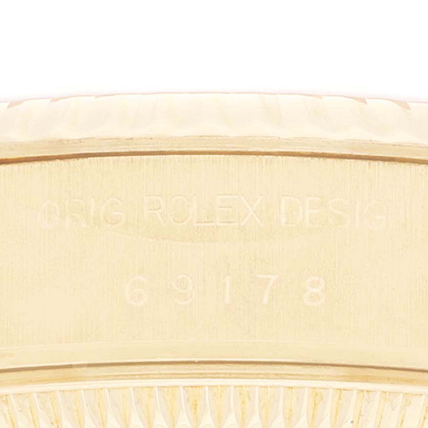 The image shows a close-up of the model number engraving on the Rolex President 69178 Women
s Yellow Gold Champagne Dial 69178 Women
s Yellow Gold Champagne Dial watch case.