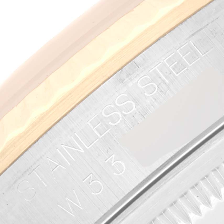 The image shows a close-up of the side engraving on the stainless steel case of a Rolex Datejust 16233 Men's Steel and Gold (two tone) Champagne Dial 16233 Men's Steel and Gold (two tone) Champagne Dial watch.