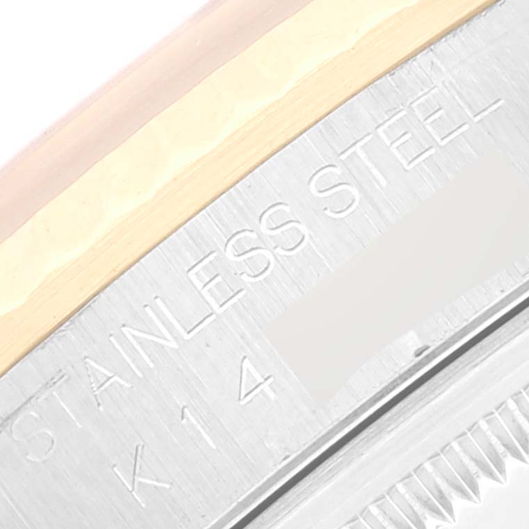 The image shows a close-up of the side of a Rolex Datejust 16233 Men's Steel and Gold (two tone) Silver Dial 16233 Men's Steel and Gold (two tone) Silver Dial, highlighting the "STAINLESS STEEL" engraving.