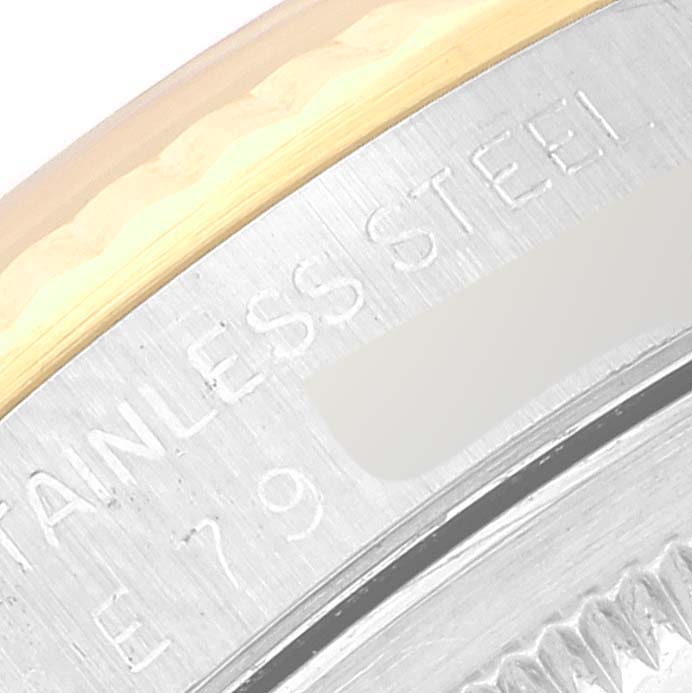 This image shows a close-up of the case back edge for a Rolex Datejust 16233 Men's Steel and Gold (two tone) Silver Dial 16233 Men's Steel and Gold (two tone) Silver Dial watch, highlighting the "STAINLESS STEEL" engraving.