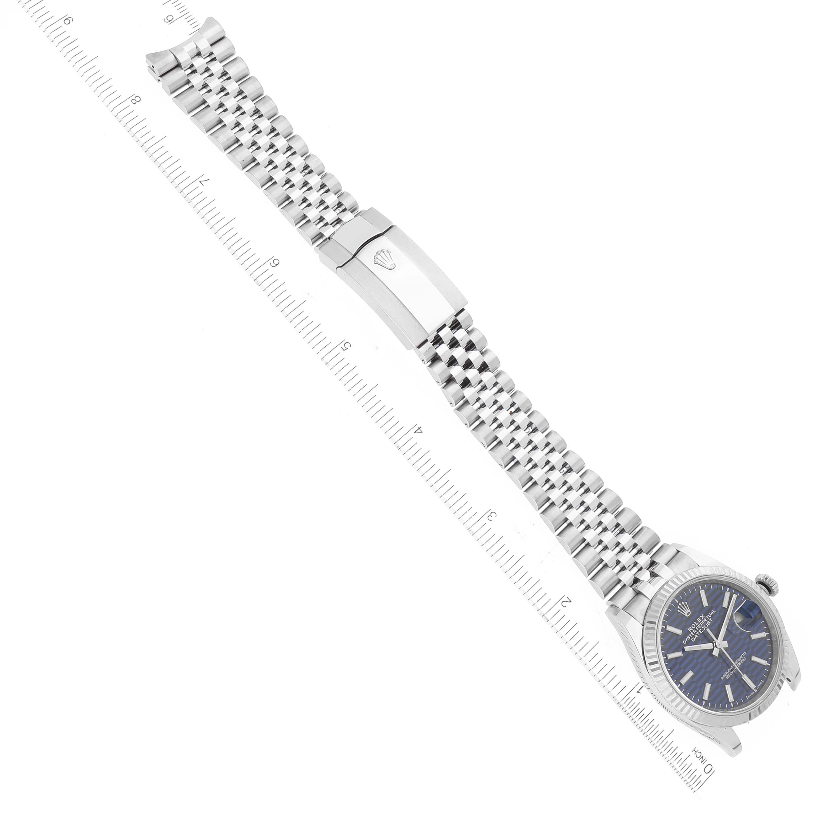 The image shows a Rolex Datejust 126234 Men's Stainless Steel Blue Dial 126234 Men's Stainless Steel Blue Dial watch from a top-down angle, featuring the full bracelet and clasp.