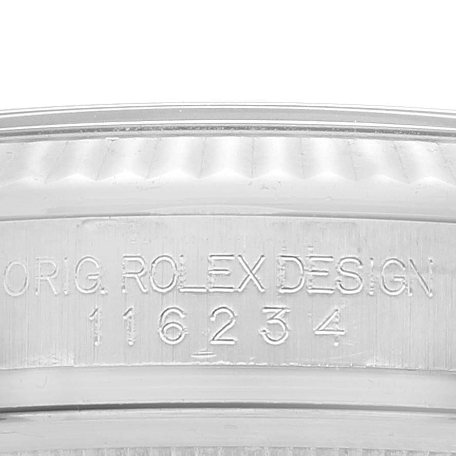 This close-up image shows the model number engraving on the side of the Rolex Datejust 116234 Men's Stainless Steel Black Dial 116234 Men's Stainless Steel Black Dial watch case.