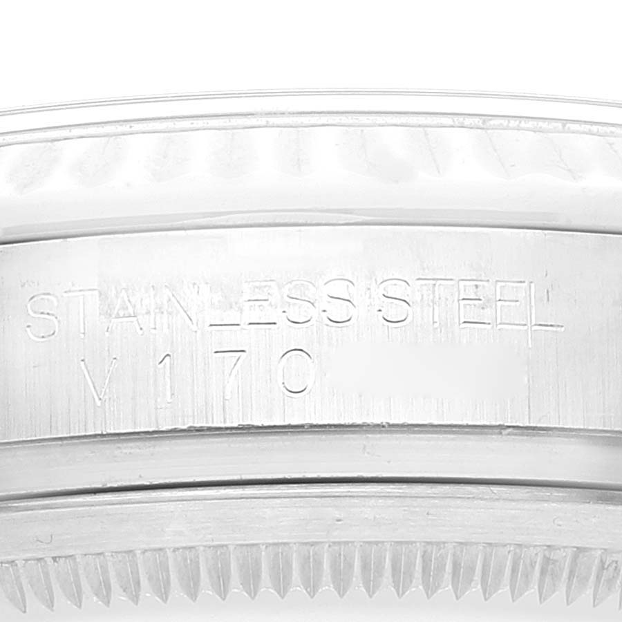 This image shows a close-up of the outer edge and serial number engraving of a stainless steel Rolex Datejust 116234 Men's Stainless Steel Black Dial 116234 Men's Stainless Steel Black Dial watch.