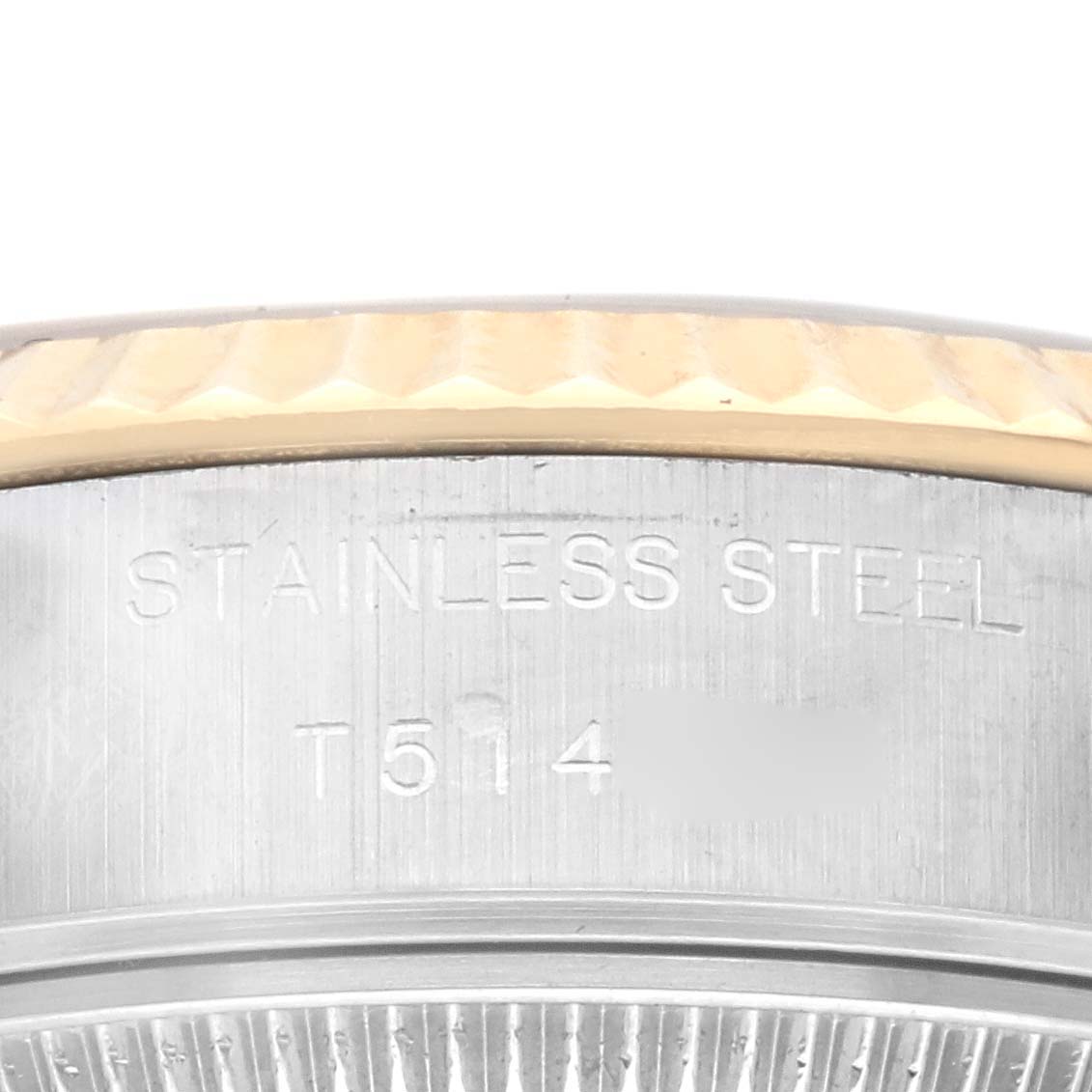 This is a close-up of the side engraving and part of the bezel of a Rolex Datejust 69173 Women's Steel and Gold (two tone) Champagne Dial 69173 Women's Steel and Gold (two tone) Champagne Dial watch.