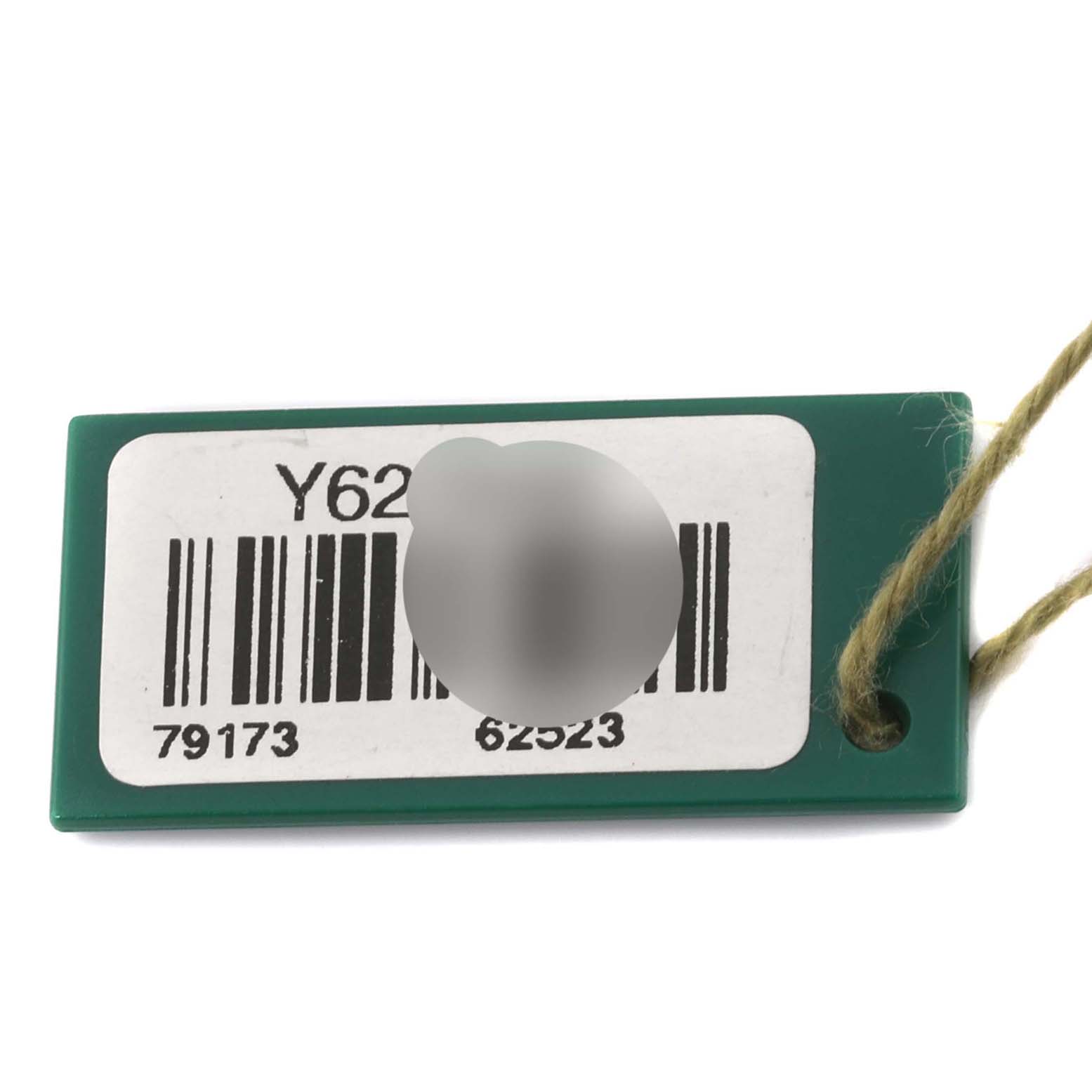 This is a close-up of a green hanging tag with a barcode for the Rolex Datejust 79173 Women's Steel and Gold (two tone) Silver Dial 79173 Women's Steel and Gold (two tone) Silver Dial model attached by a string.