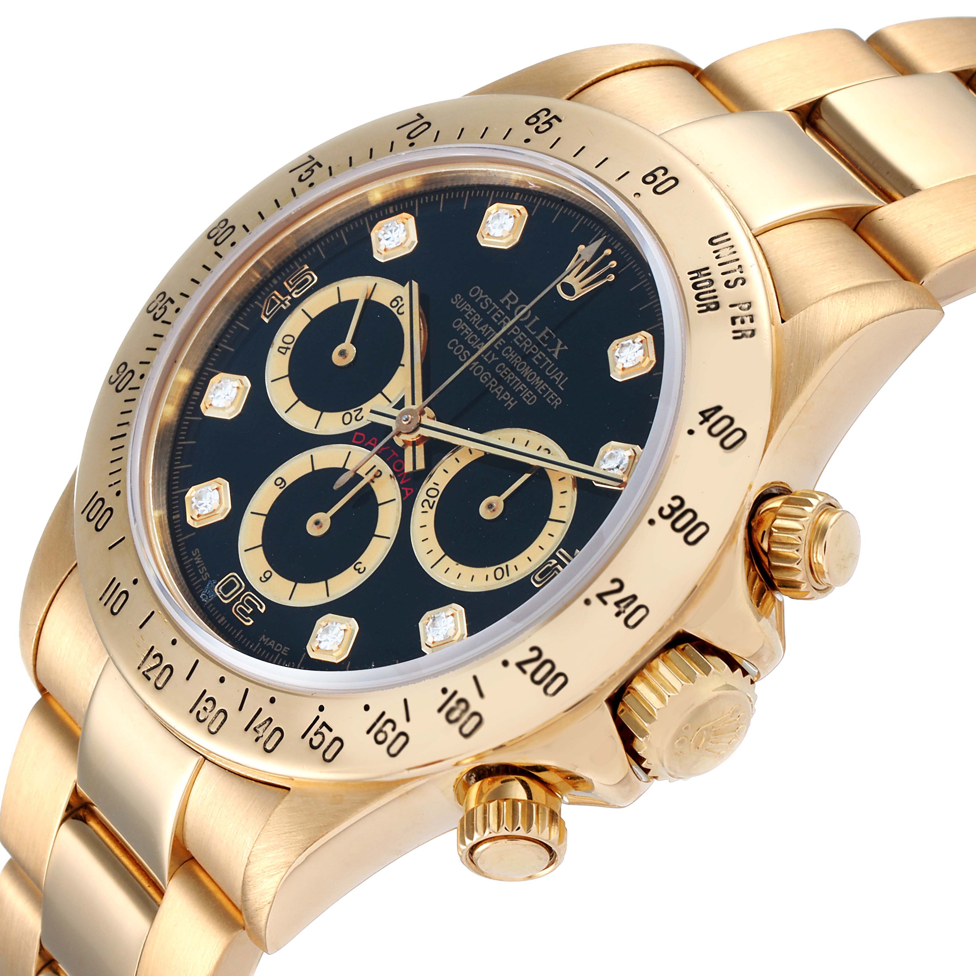 This image shows a close-up angle of the dial, bezel, and crown of a Rolex Daytona 16528 Men's Yellow Gold Black Dial 16528 Men's Yellow Gold Black Dial watch.
