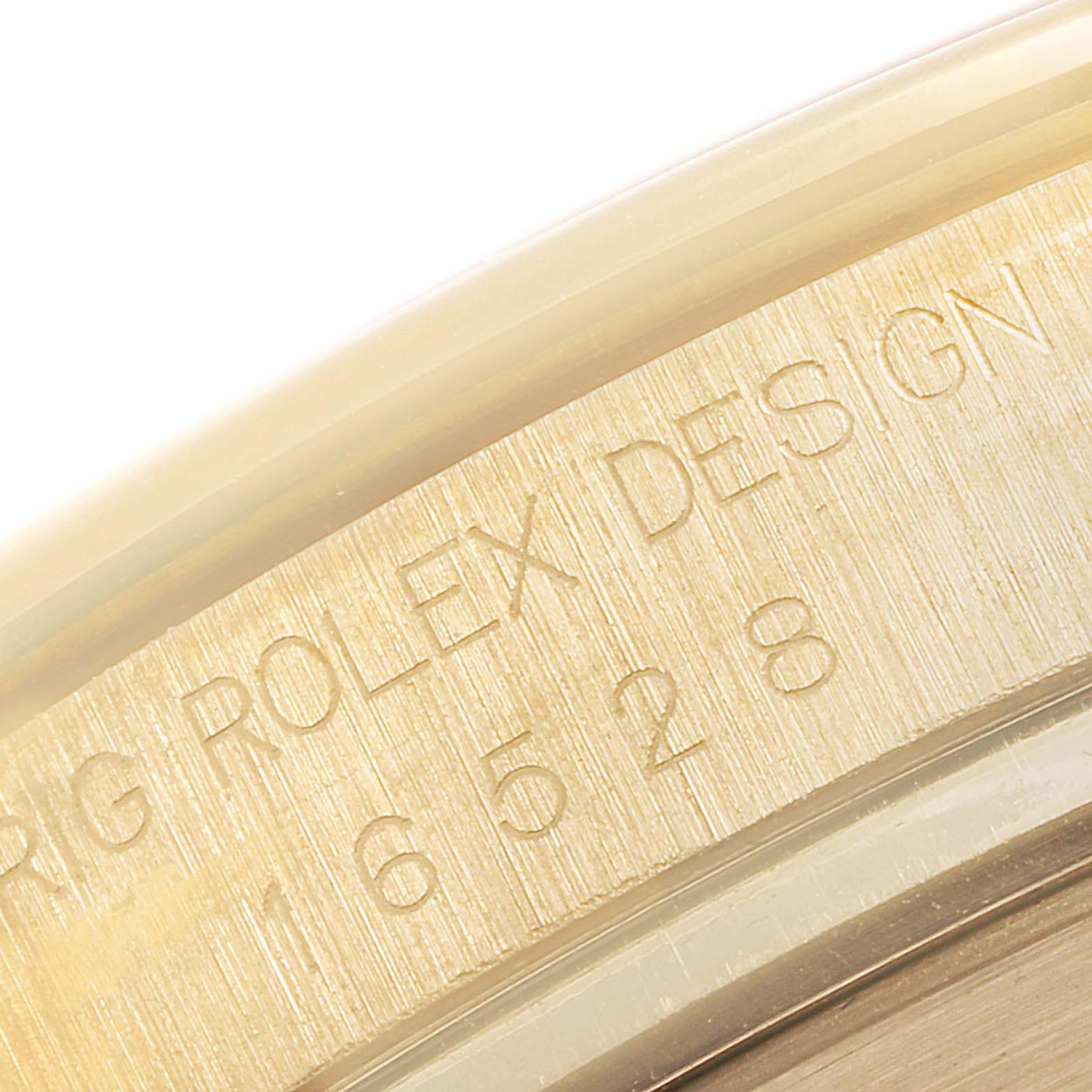 The image shows a close-up of the case side of a Rolex Daytona 16528 Men's Yellow Gold Black Dial 16528 Men's Yellow Gold Black Dial, highlighting the engraved "ROLEX DESIGN 16528" text.