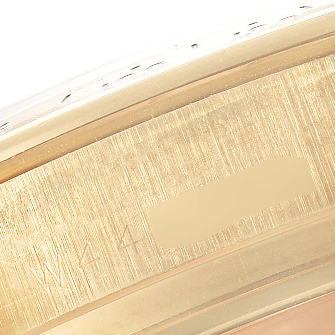 This image shows a close-up angle of the side case of a Rolex Daytona 16528 Men's Yellow Gold Black Dial 16528 Men's Yellow Gold Black Dial watch, focusing on the model number engraving.