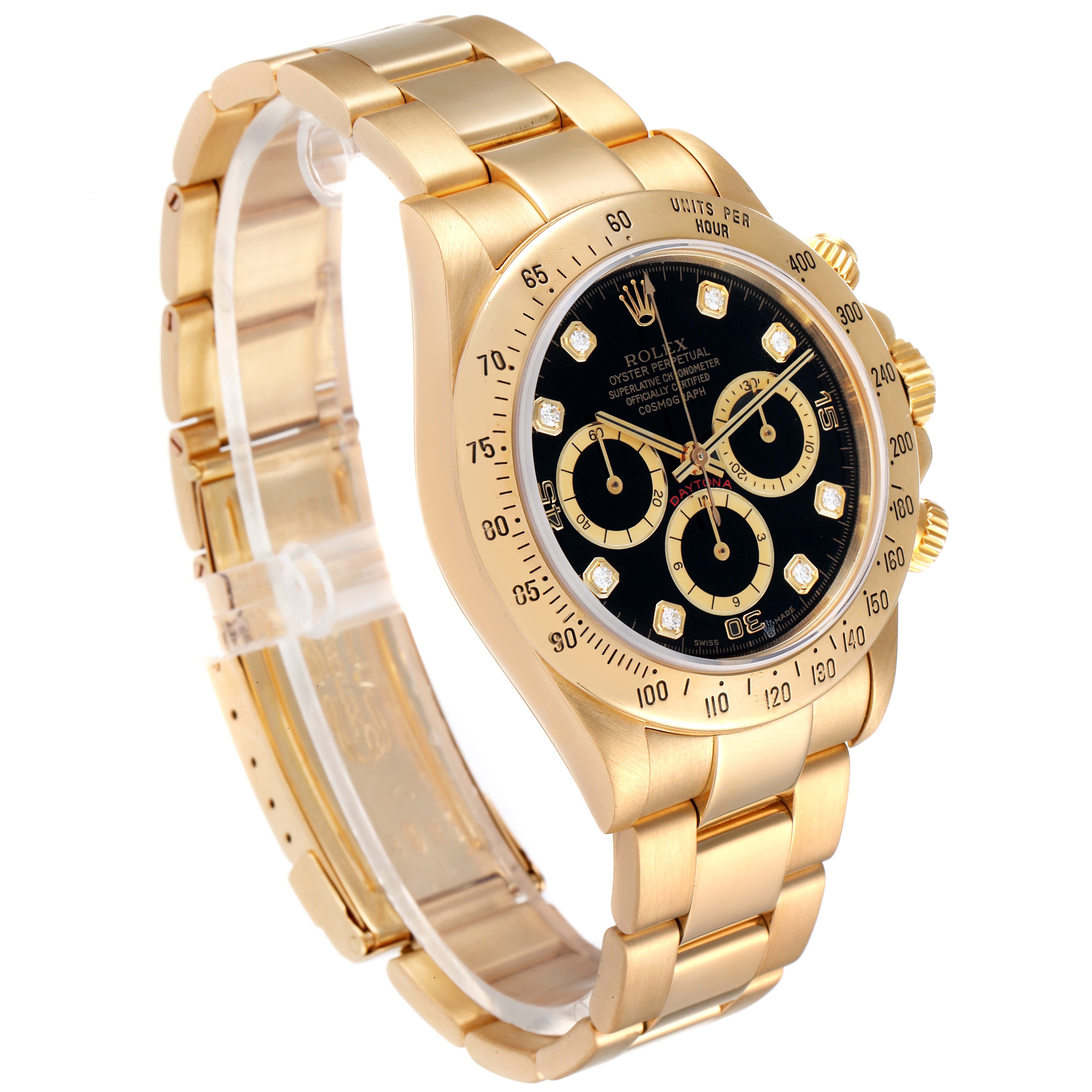 The image shows a Rolex Daytona 16528 Men's Yellow Gold Black Dial 16528 Men's Yellow Gold Black Dial watch in gold, viewed from a left side-angle, highlighting the bracelet, face, and crown.