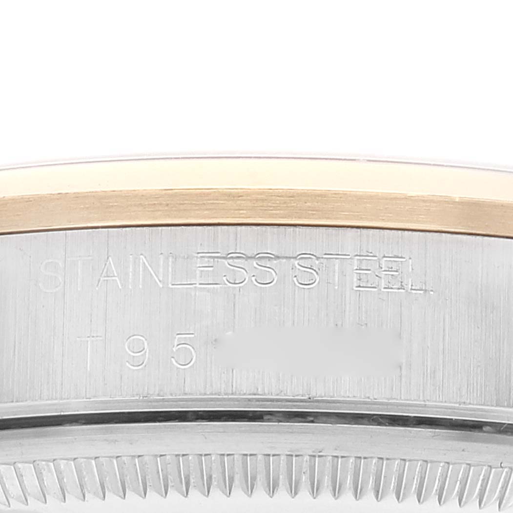 This image shows a close-up side view of the stainless steel case back of a Rolex Oyster Perpetual 14203 Men's Steel and Gold (two tone) Grey Dial 14203 Men's Steel and Gold (two tone) Grey Dial watch.