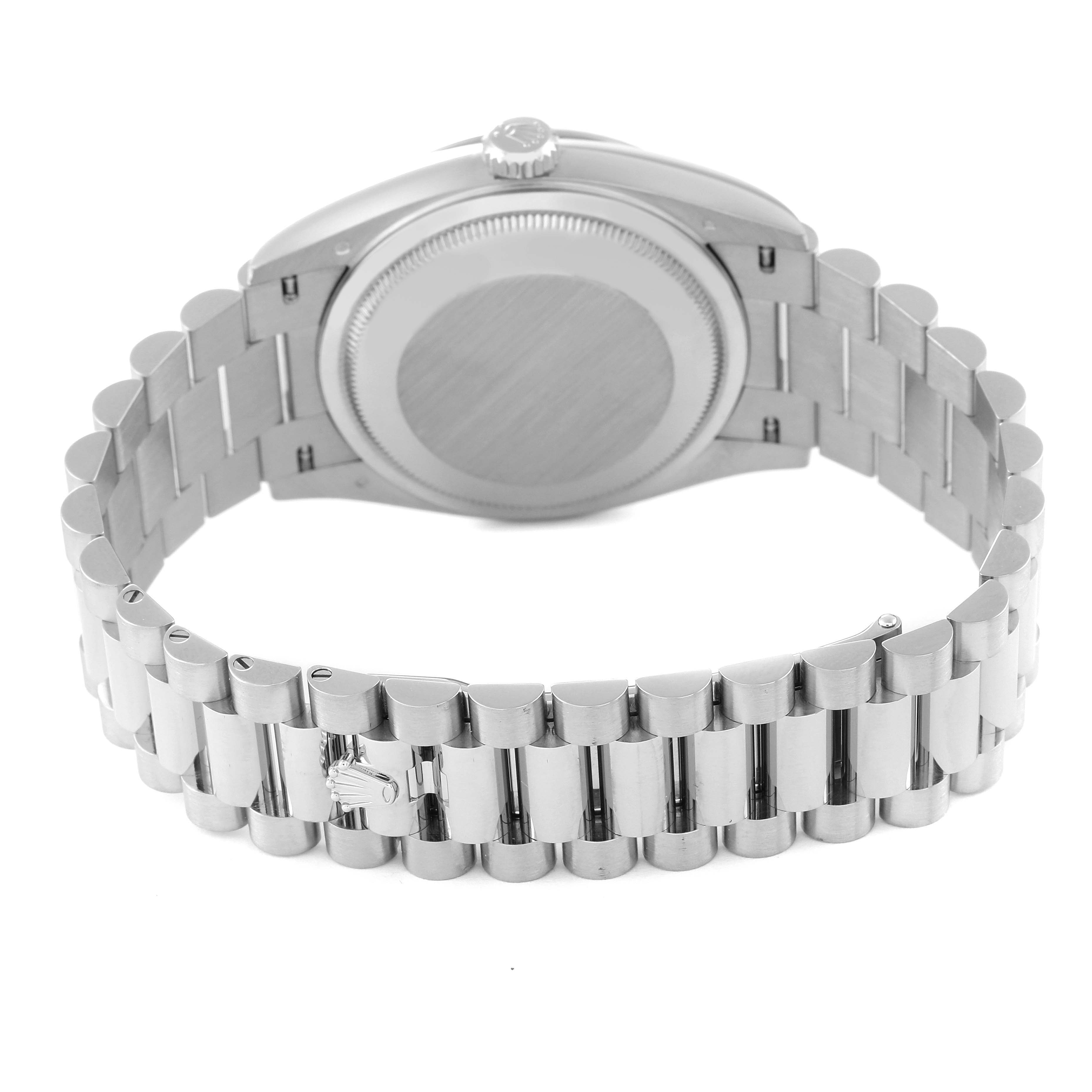 The image shows the back and bracelet of a Rolex President 128239 Men's White Gold Blue Dial 128239 Men's White Gold Blue Dial model watch, highlighting the case back and link bracelet.