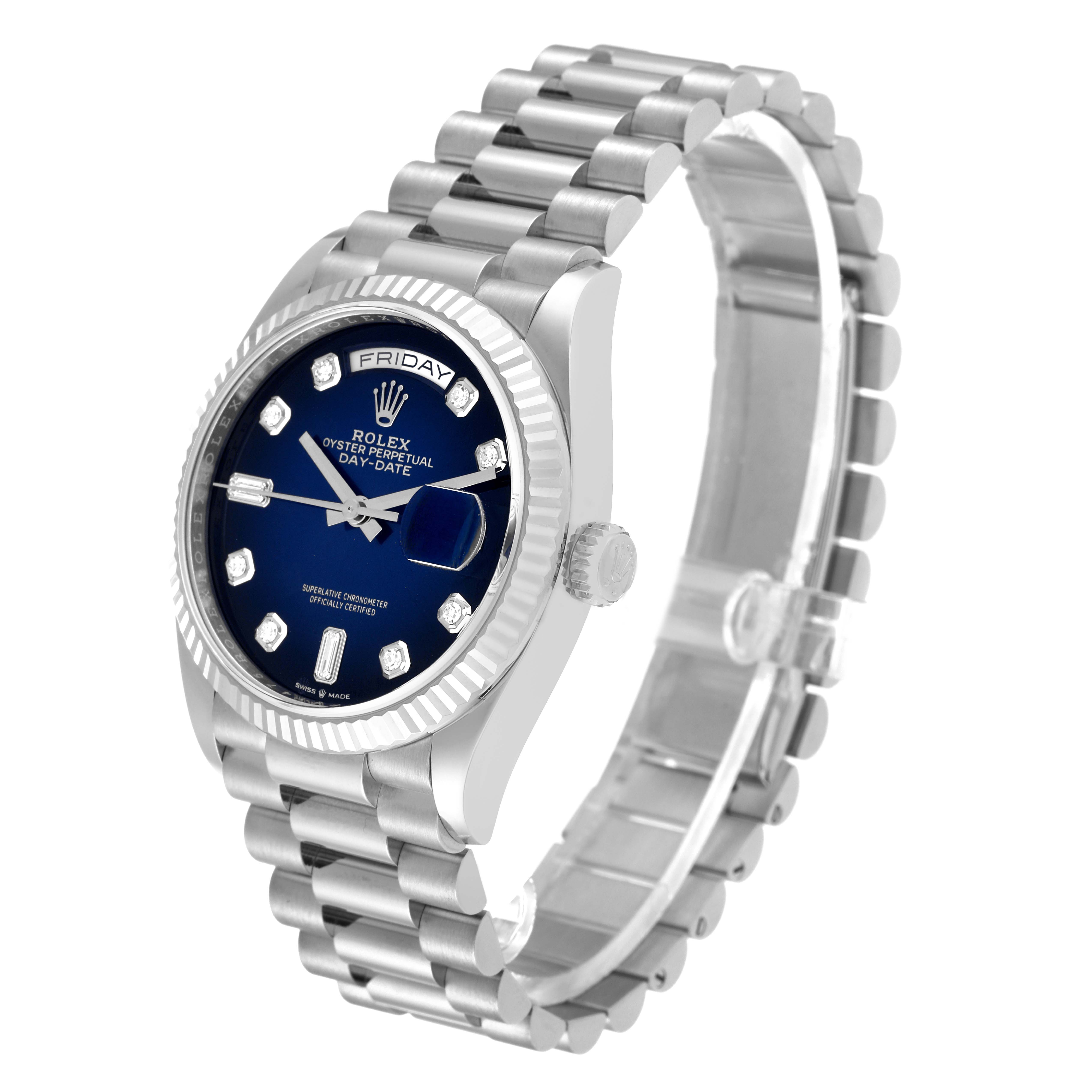 This image shows a Rolex President 128239 Men's White Gold Blue Dial 128239 Men's White Gold Blue Dial model watch with a blue dial, a fluted bezel, and a silver bracelet in a three-quarter view angle.
