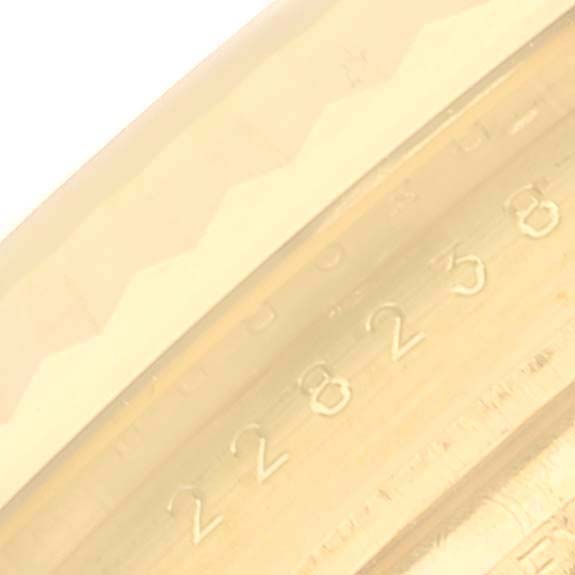 Close-up of the serial number engraving on the case of a Rolex President 228238 Men's Yellow Gold Champagne Dial 228238 Men's Yellow Gold Champagne Dial model watch.