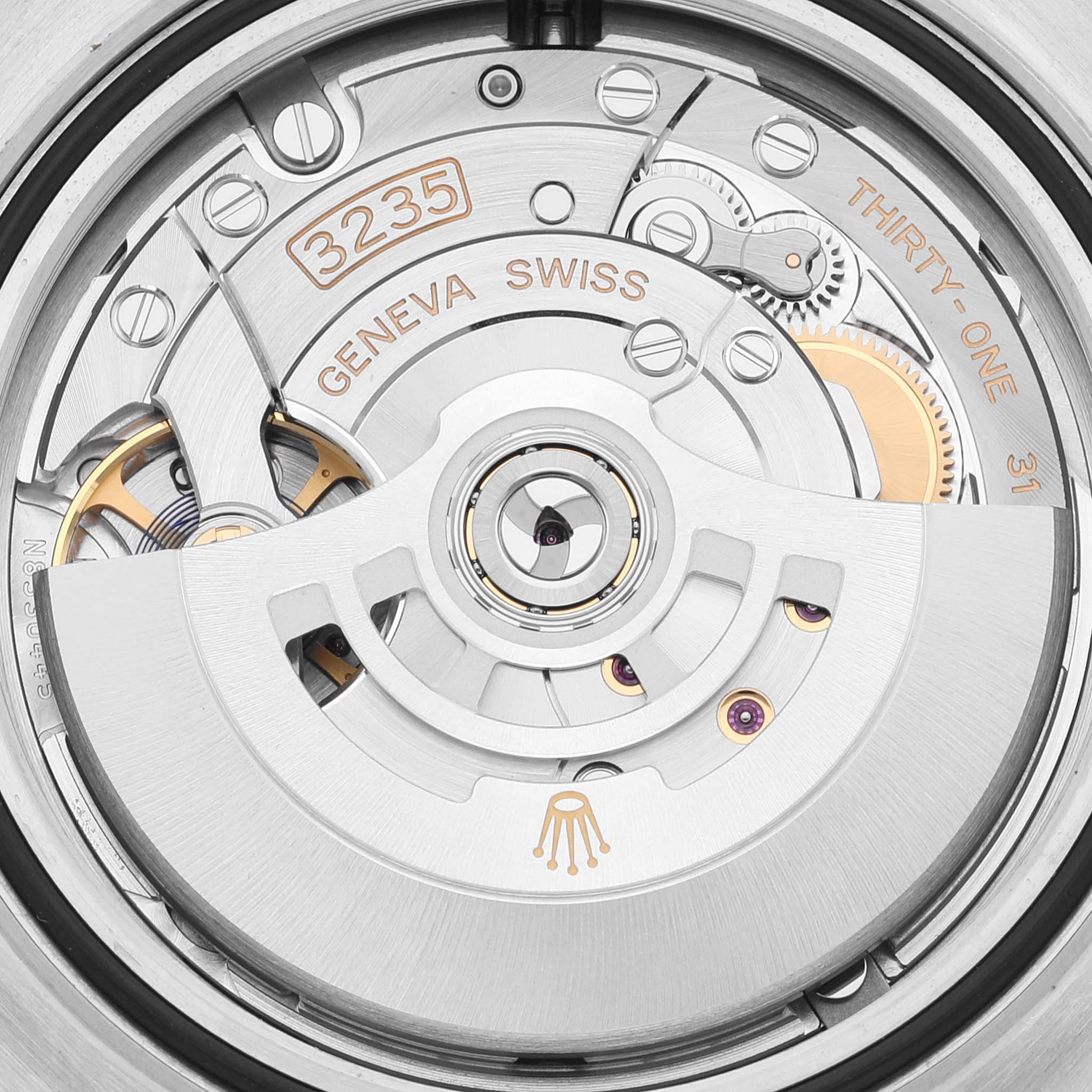 This image shows the movement mechanism of a Rolex Sea-Dweller 126603 Men's Steel and Gold (two tone) Black Dial 126603 Men's Steel and Gold (two tone) Black Dial watch, specifically the caliber 3235 with a close-up view of its intricate parts.