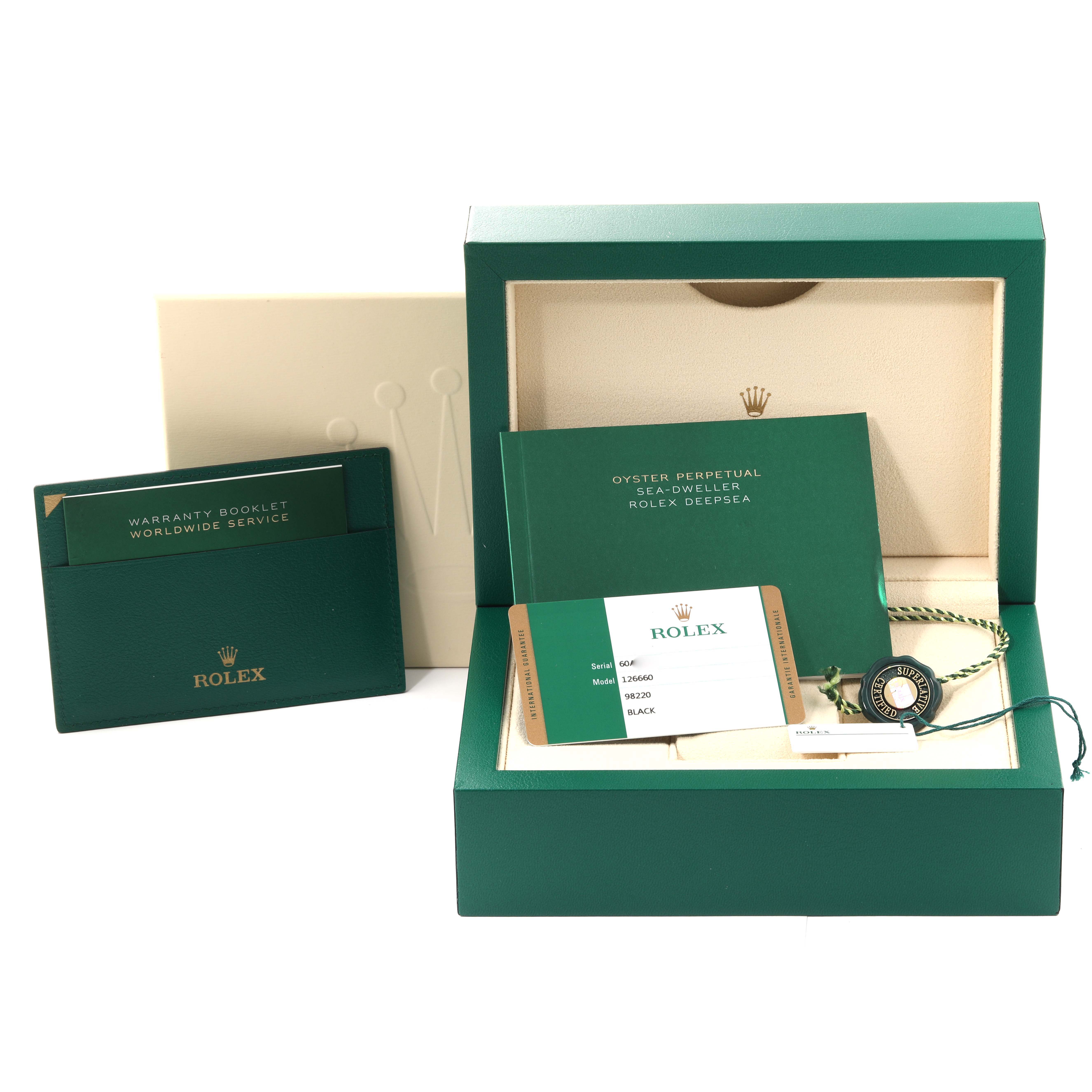 The image shows the packaging, warranty booklet, manuals, and authenticity card for a Rolex Sea-Dweller 126660 Men's Stainless Steel Black Dial 126660 Men's Stainless Steel Black Dial watch.