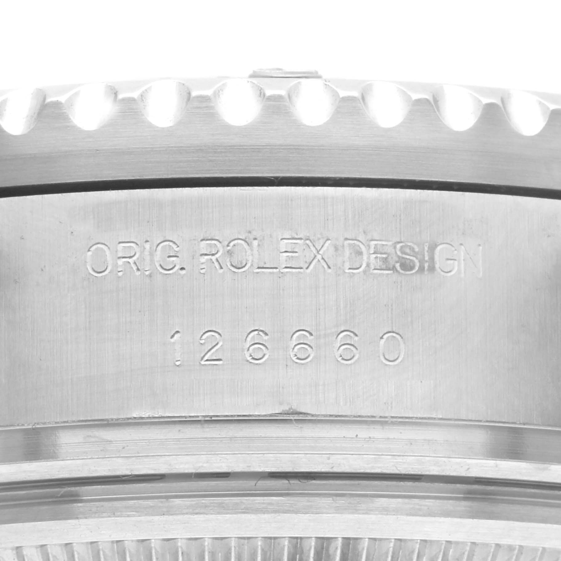 This image shows a close-up of the side engraving on the bezel and case of a Rolex Sea-Dweller 126660 Men's Stainless Steel Black Dial 126660 Men's Stainless Steel Black Dial model.