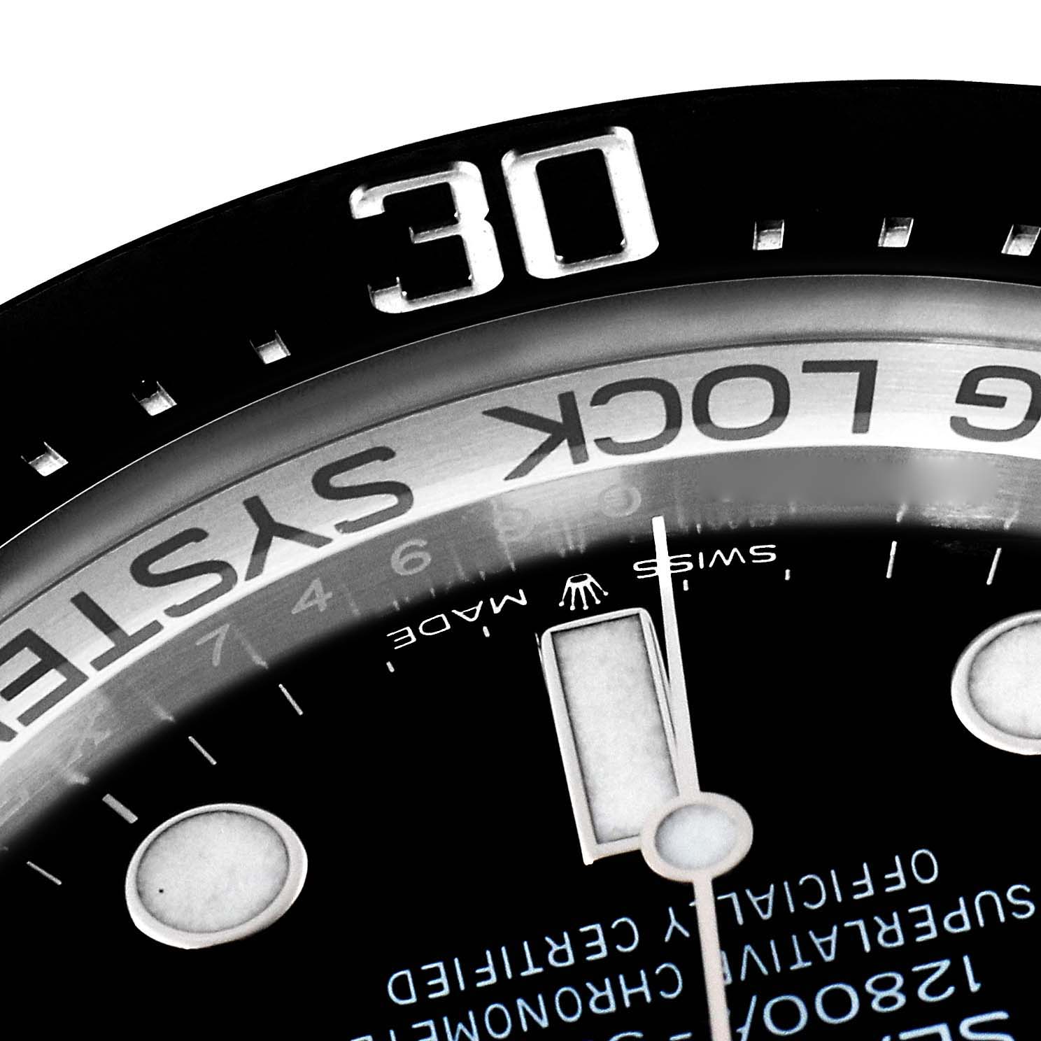 The image shows a close-up of the bezel, part of the dial, and the minute hand of a Rolex Sea-Dweller 126660 Men's Stainless Steel Blue Dial 126660 Men's Stainless Steel Blue Dial watch.