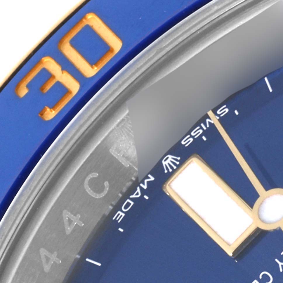 The image shows a close-up view of the Rolex Submariner 126613LB Men's Steel and Gold (two tone) Blue Dial 126613LB Men's Steel and Gold (two tone) Blue Dial watch, highlighting the blue bezel with the "30" marker and a portion of the dial.