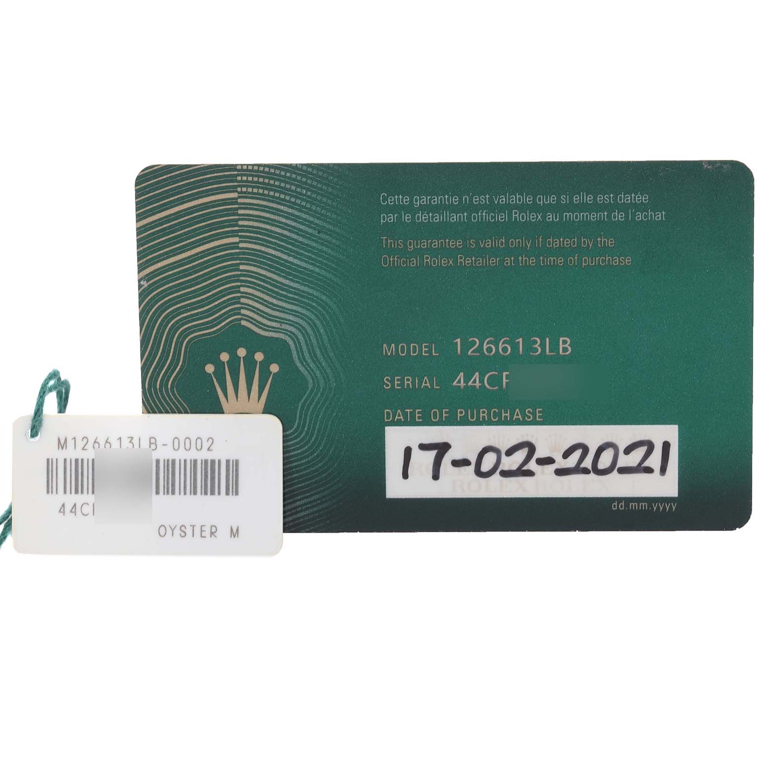 This image shows the warranty card and a tag for the Rolex Submariner 126613LB Men's Steel and Gold (two tone) Blue Dial 126613LB Men's Steel and Gold (two tone) Blue Dial model 126613LB.