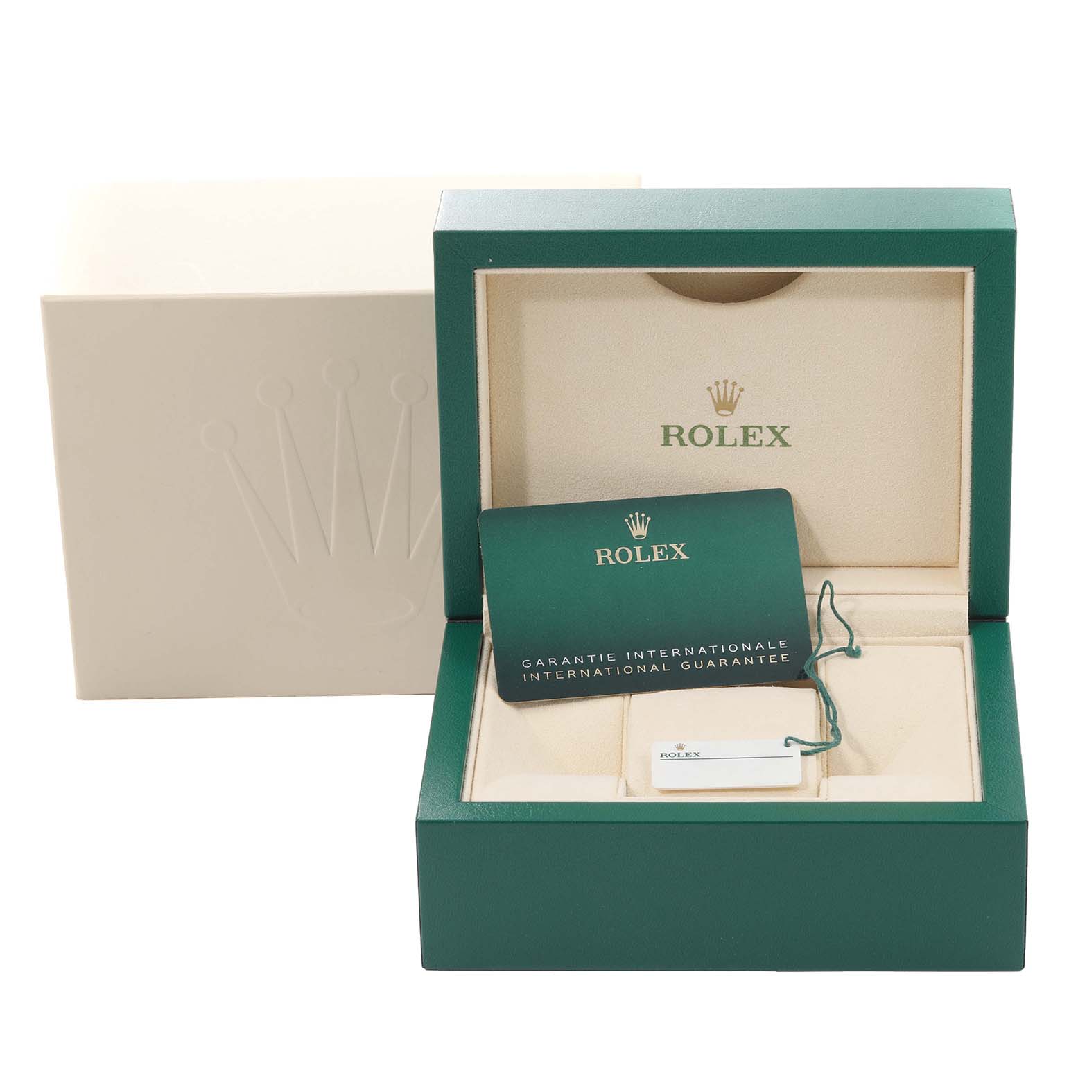 This image shows the open box and international guarantee card for a Rolex Submariner 126613LB Men's Steel and Gold (two tone) Blue Dial 126613LB Men's Steel and Gold (two tone) Blue Dial watch.