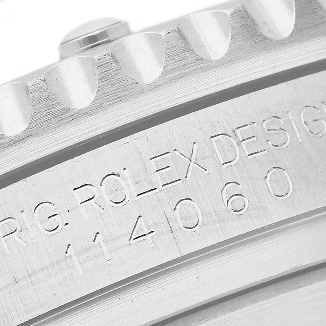 The image shows a close-up of the Rolex Submariner 114060 Men
s Stainless Steel Black Dial 114060 Men
s Stainless Steel Black Dial
s caseback with visible engraving and part of the bezel.