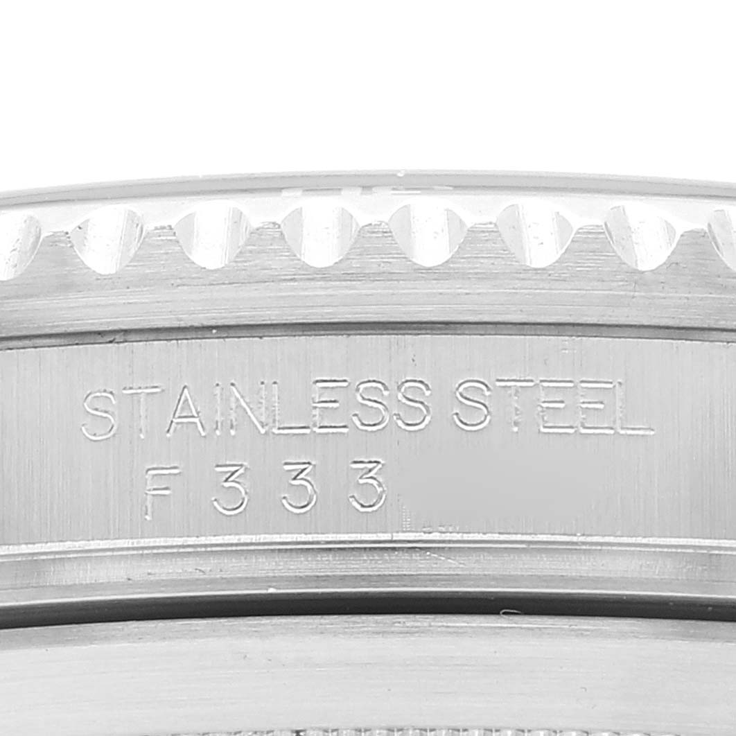 This image shows a close-up of the stainless steel bezel with the engraved text on a Rolex Submariner 16610LV Men's Stainless Steel Black Dial 16610LV Men's Stainless Steel Black Dial watch.