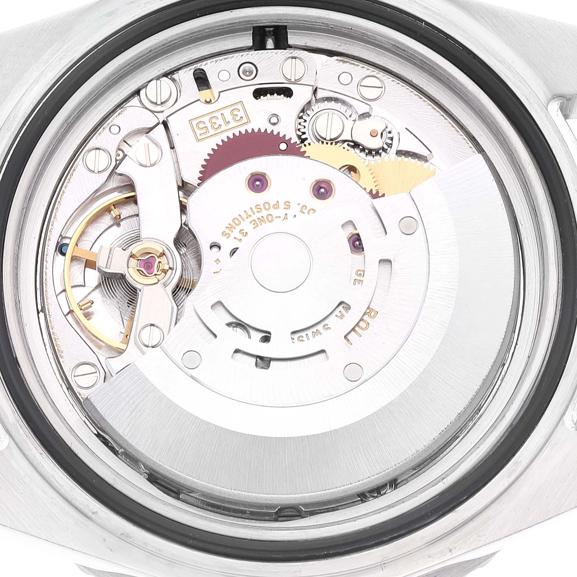 This image shows a close-up of the internal mechanism of a Rolex Submariner 16610LV Men's Stainless Steel Black Dial 16610LV Men's Stainless Steel Black Dial watch from the back.