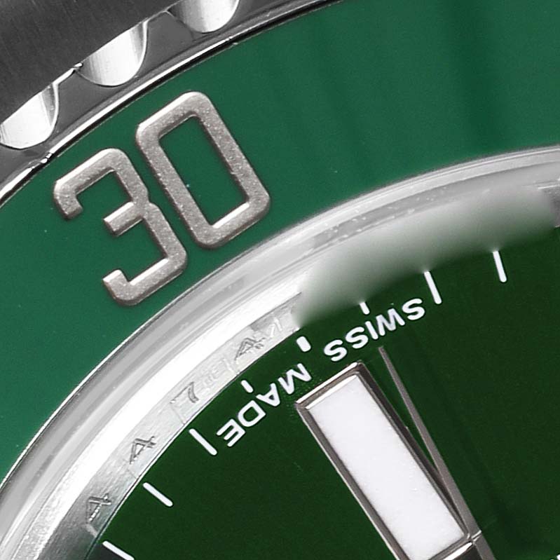 The image shows a close-up of the bezel, dial, and part of the minute marker on the Rolex Submariner 116610LV Men's Stainless Steel Green Dial 116610LV Men's Stainless Steel Green Dial watch.