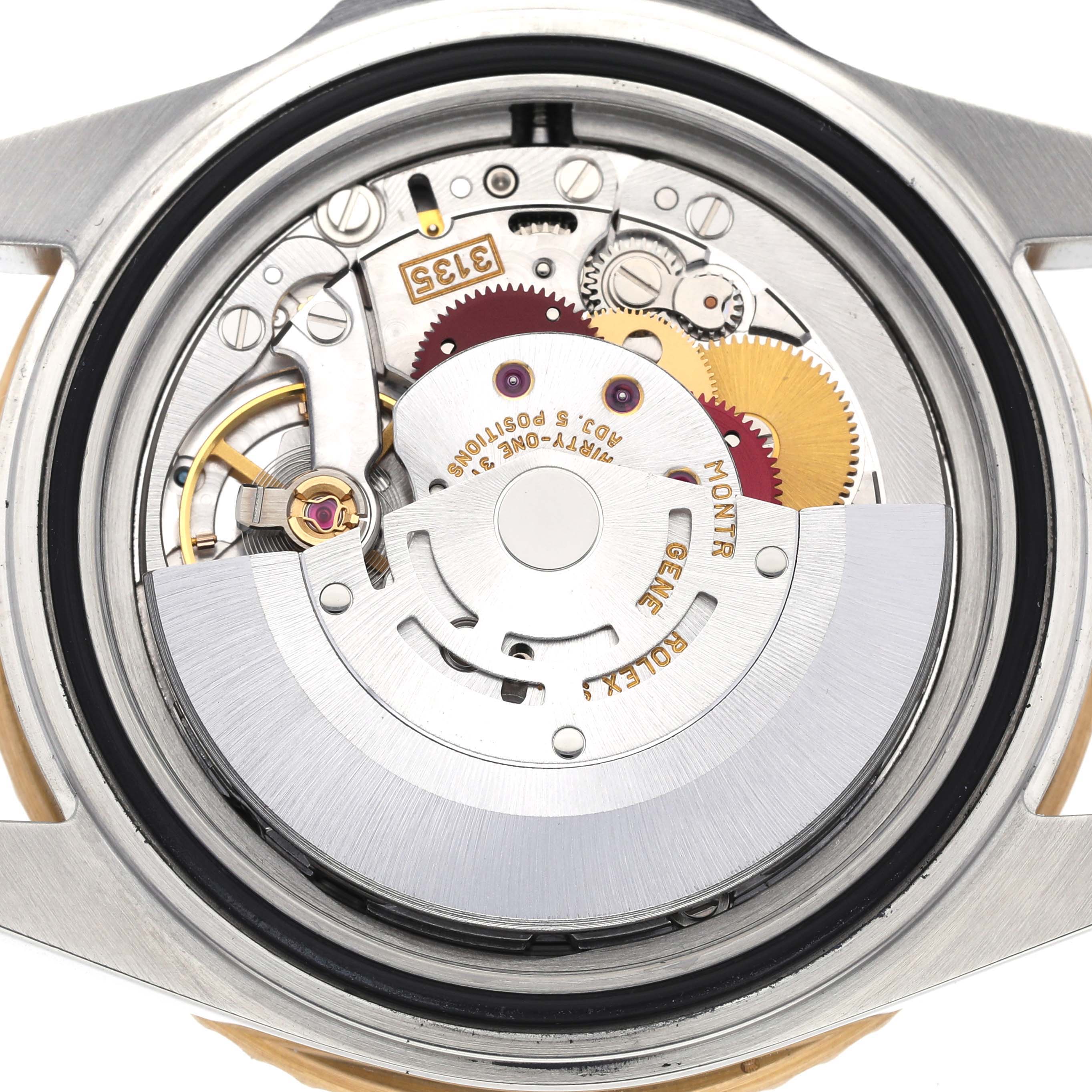 The image shows an open case back view of a Rolex Submariner 16613 Men's Steel and Gold (two tone) Black Dial 16613 Men's Steel and Gold (two tone) Black Dial watch, revealing its intricate movement components.